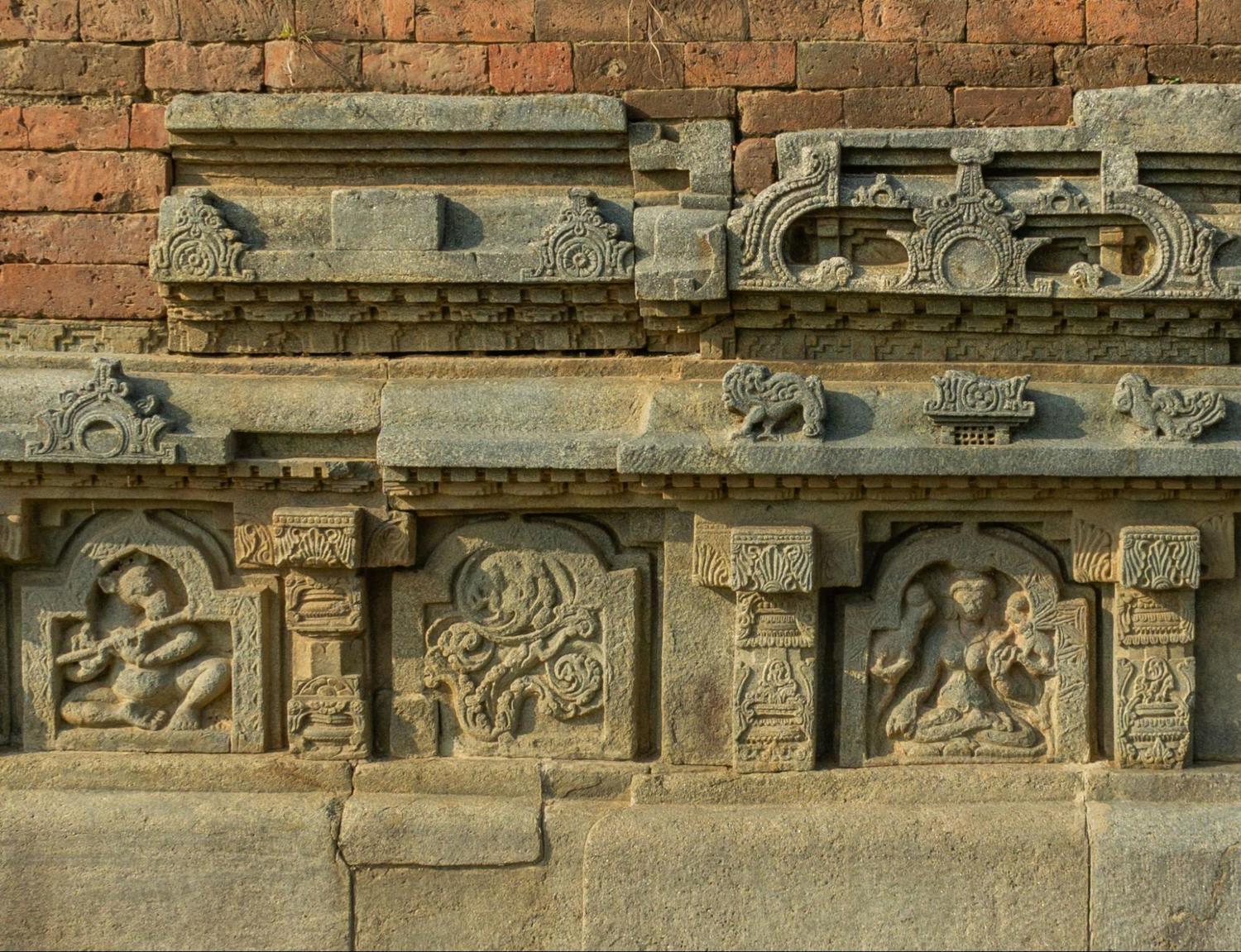 Intricate carvings on the walls of Nalanda