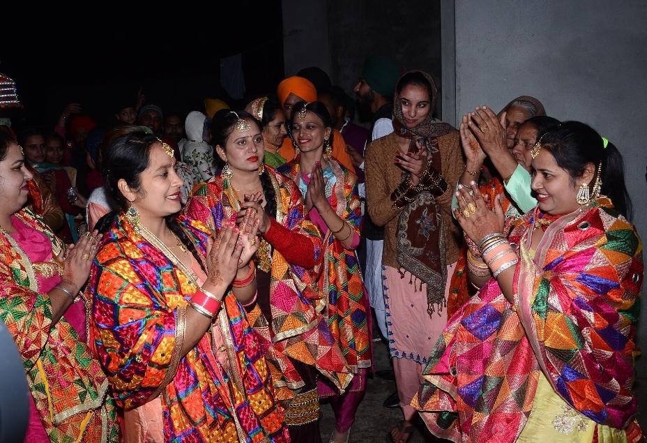 Women in scarf with Phulkari design