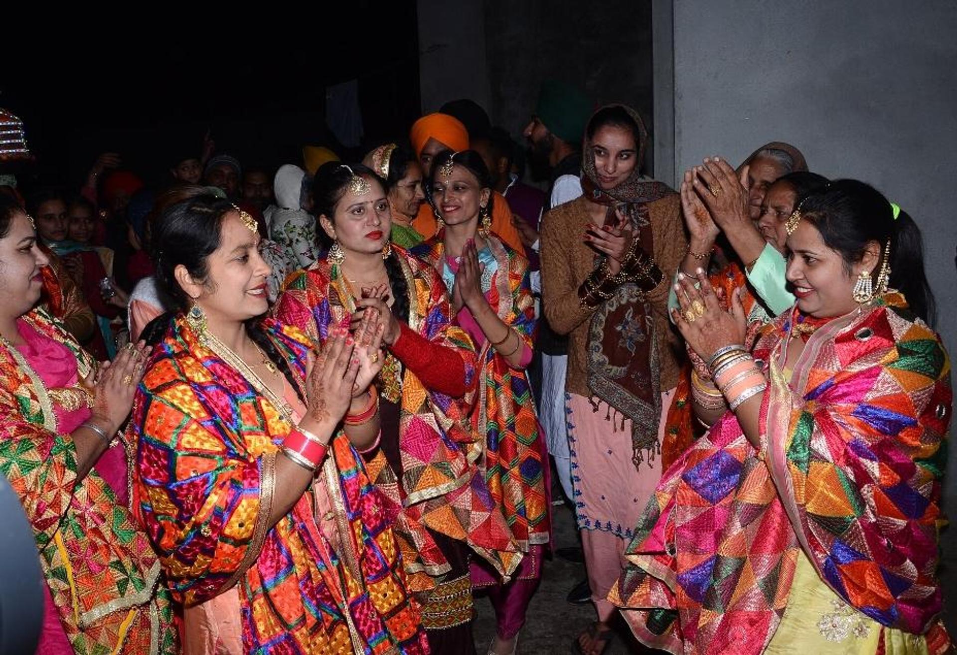 Women in scarf with Phulkari design