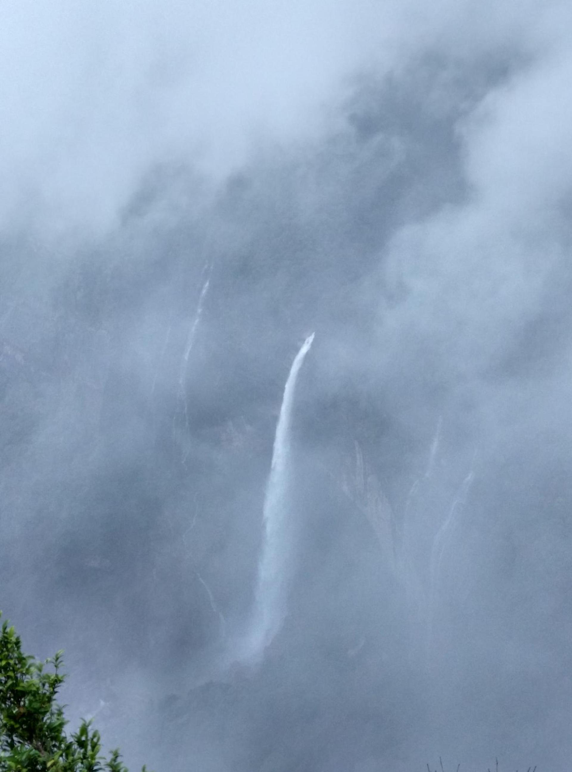 Nohkalikai Fall is covered in fog