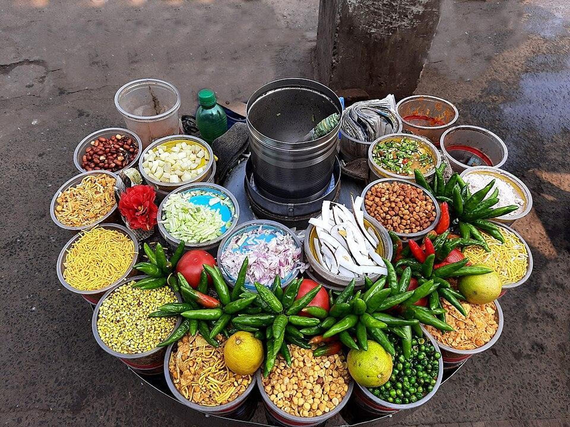Jhalmuri, puffed rice tossed with mustard oil, chilli and chopped vegetables