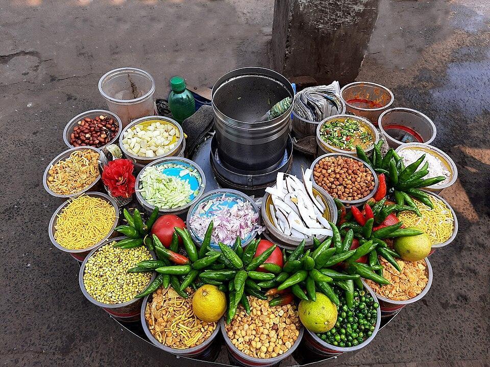 Jhalmuri, puffed rice tossed with mustard oil, chilli and chopped vegetables