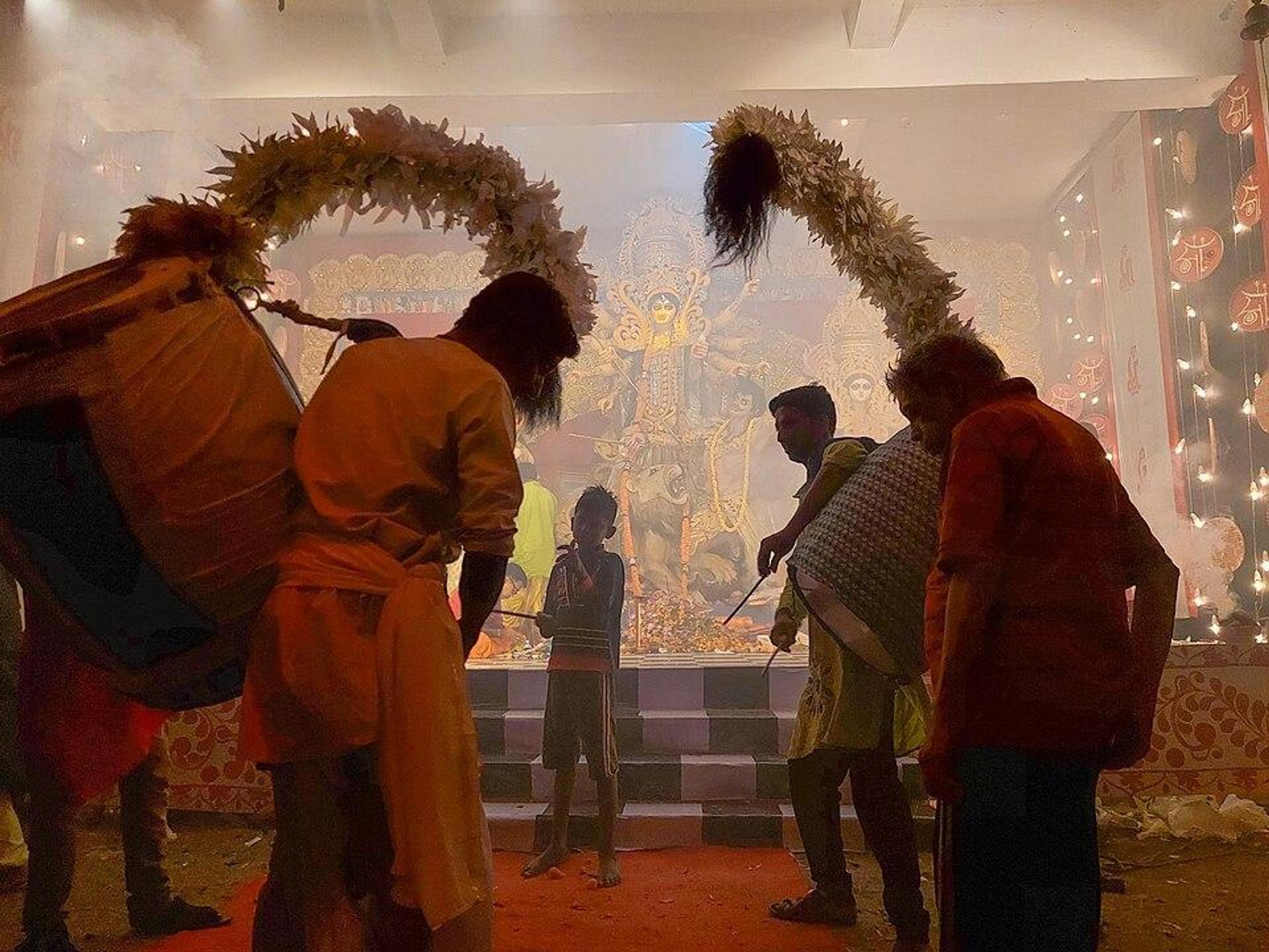 Dakis playing traditional instrument Dhak to worship Goddess Durga in traditional ritual during Durga Puja