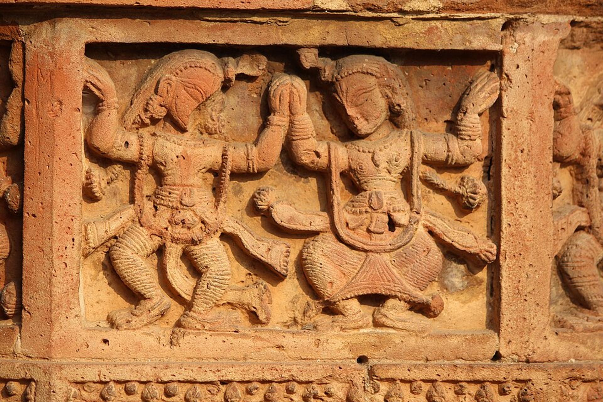 Mythological figure carved into terracotta panel with detailed relief, bishnupur, west Bengal