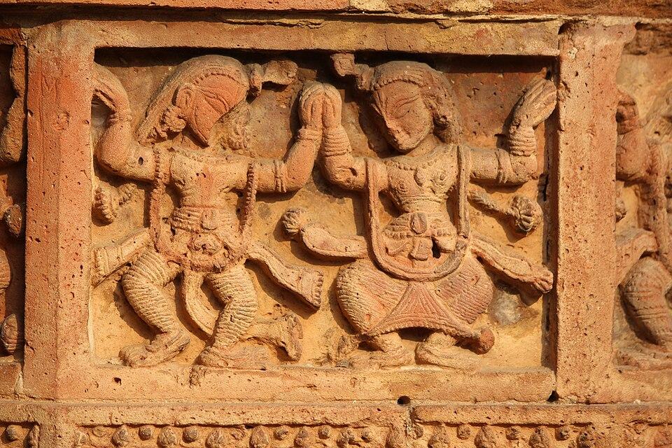 Mythological figure carved into terracotta panel with detailed relief, bishnupur, west Bengal