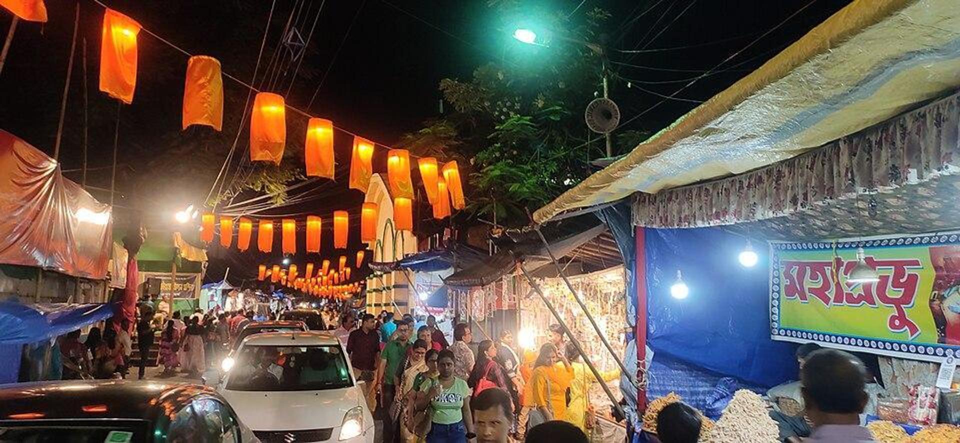 Decorated street with pop-up stalls during Durga Puja