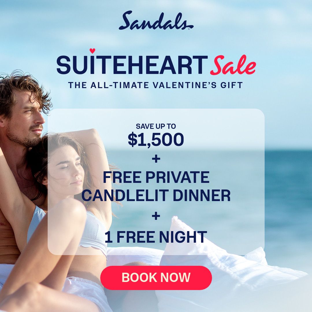 Romantic couple in swimwear lounging by an infinity pool with turquoise ocean and clear blue sky in background at Sandals resort. Promotional text reads "Suiteheart Sale - The All-timate Valentine's Gift" with offer details: Save up to $1,500 plus free private candlelit dinner plus 1 free night, with red "Book Now" button.