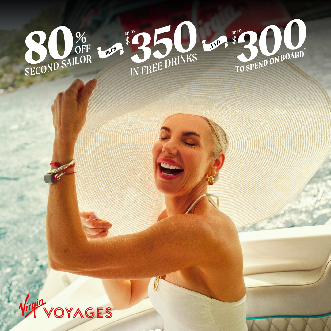 a woman in a white dress and a white hat enjoying her vacation