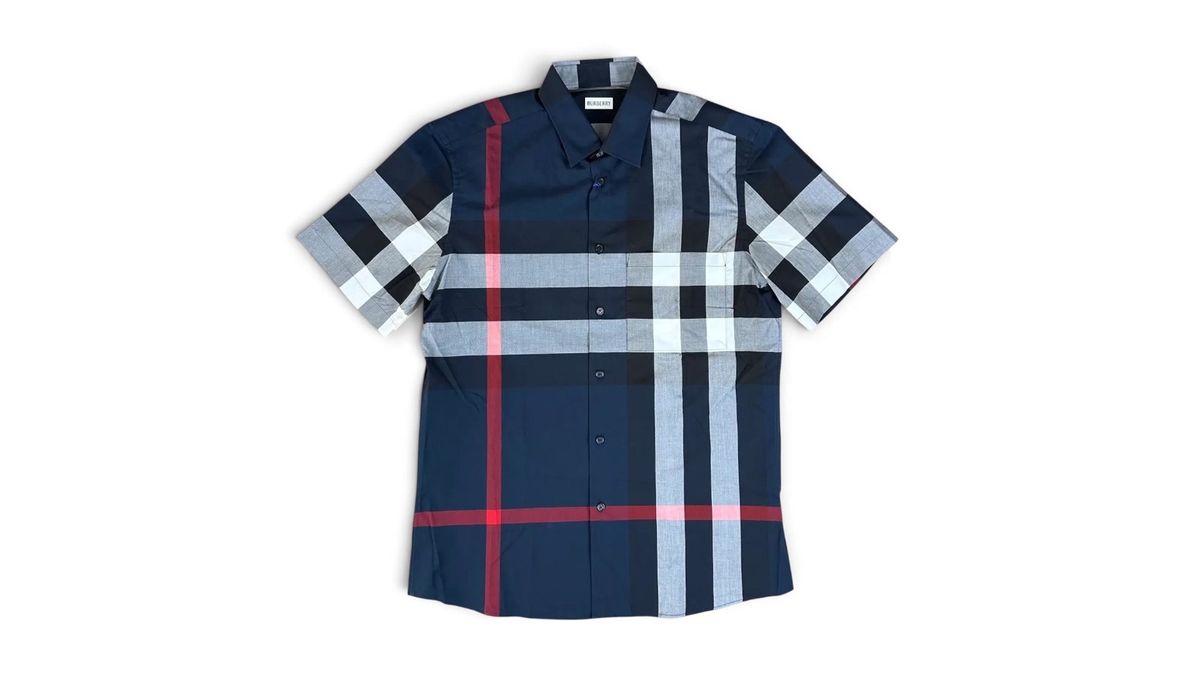 A Burberry Check short-sleeve shirt in navy, laid flat