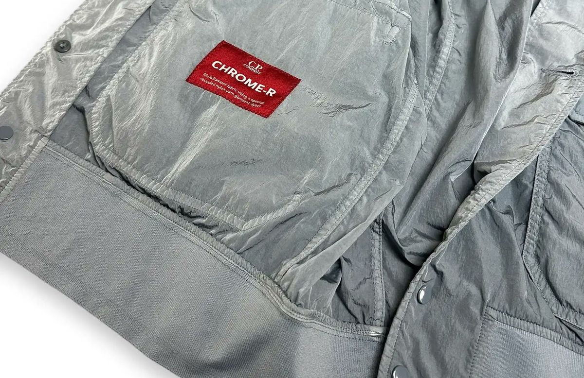C.P. Company Chrome-R label reading "multifilament fabric using a special recycled nylon yarn, garment dyed"