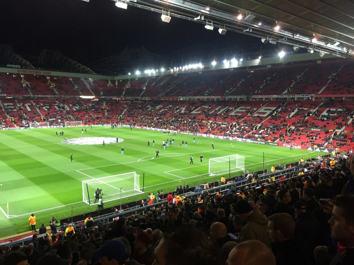 Old Trafford’s Stretford End under floodlights during a Manchester United night match, November 2016