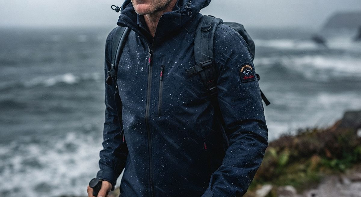 a Paul & Shark Typhoon jacket, ideally shown in wet or windy conditions to illustrate the weatherproofing claim made above