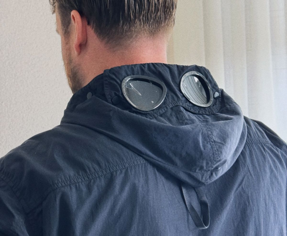 C.P. Company Goggle Jacket, front view, hood up and goggles down over the eyes