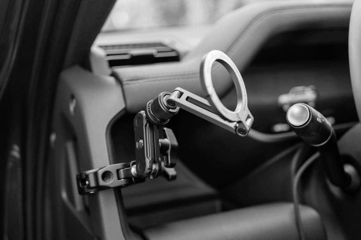 Detail view of the ULANZI Super Clamp and double ball-head arm hardware, showing how the mount attaches to the grab handle