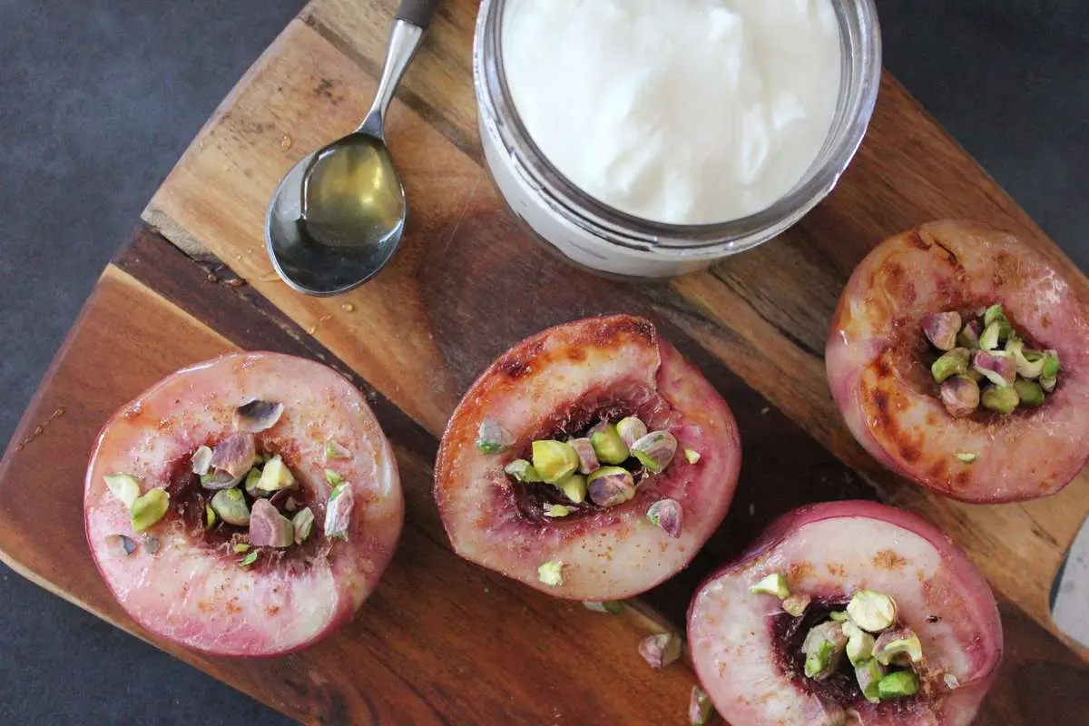 grilled_peaches_with_pistachios_and_yoghurt_after_dinner_-_lisa_guy.jpg