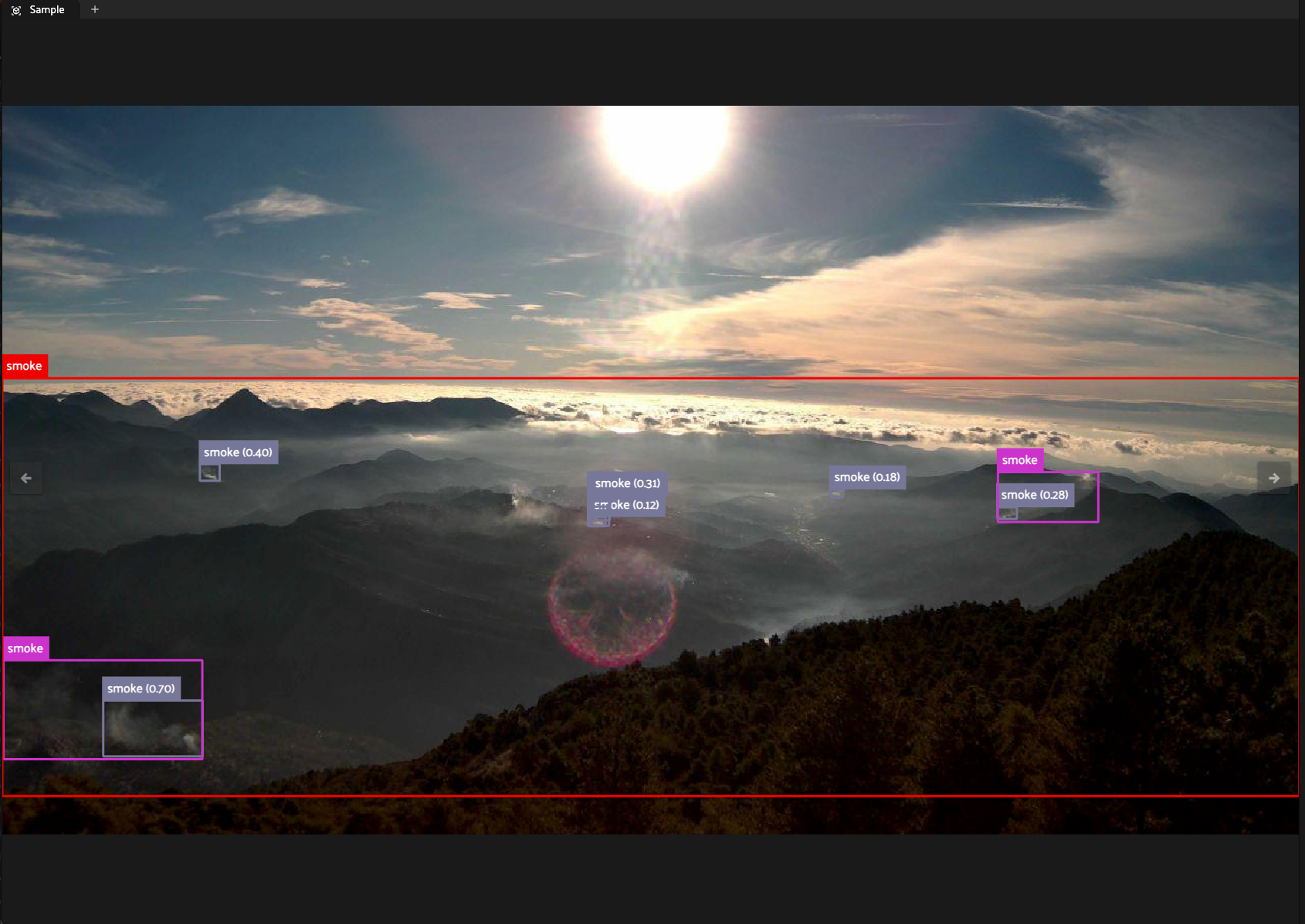 FiftyOne sample view of a mountain landscape with overlapping smoke bounding boxes from three sources: pink ground truth labels, grey Pyronear model predictions, and a red LocateAnything prediction, used to corroborate annotation accuracy across independent models.