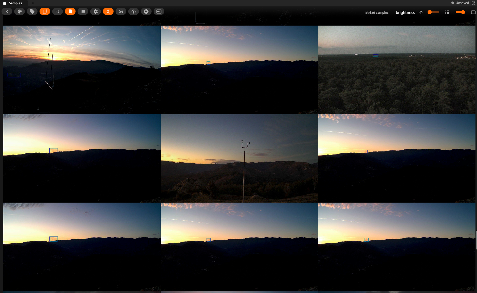 FiftyOne App grid view of nine low-brightness Pyro-SDIS frames sorted by image quality score, showing dusk and nighttime wildfire camera scenes flagged during structural analysis.