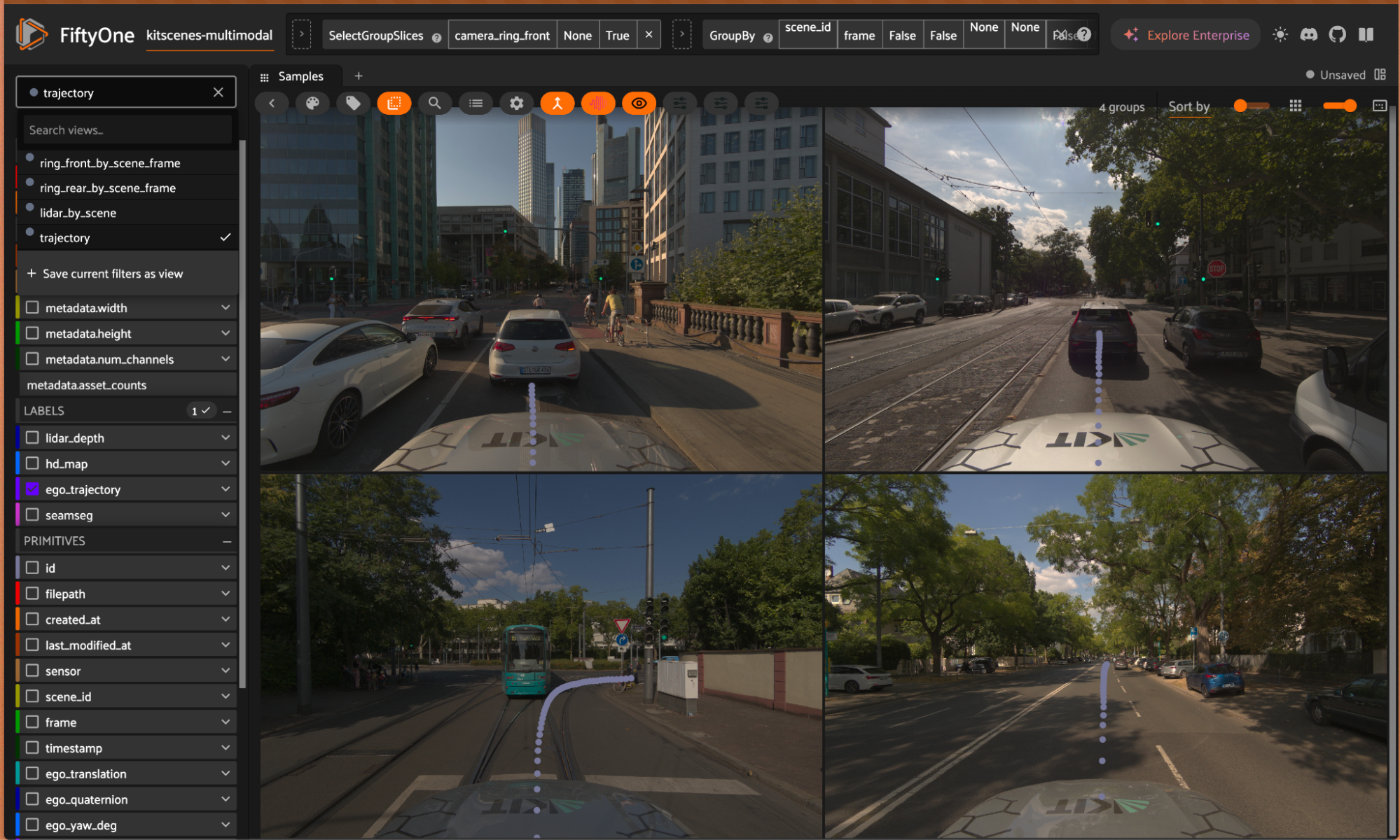 A grouped saved view in the FiftyOne App showing four KITScenes Multimodal scenes at once, with the ego trajectory drawn on each.