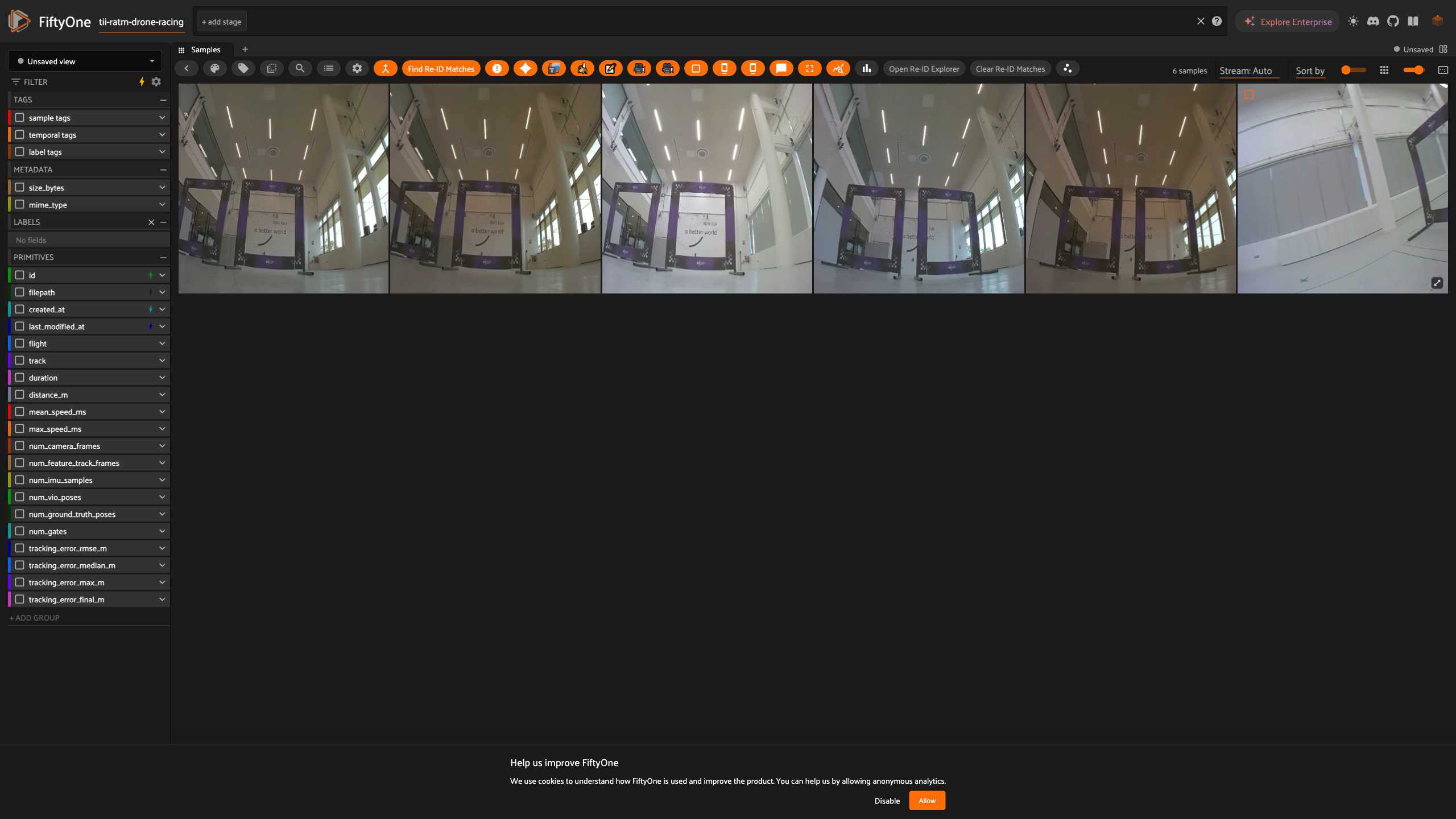 FiftyOne grid view of the tii-ratm-drone-racing dataset, six flight samples each shown as a fisheye thumbnail of the indoor track gates, with tracking error fields listed in the sidebar.