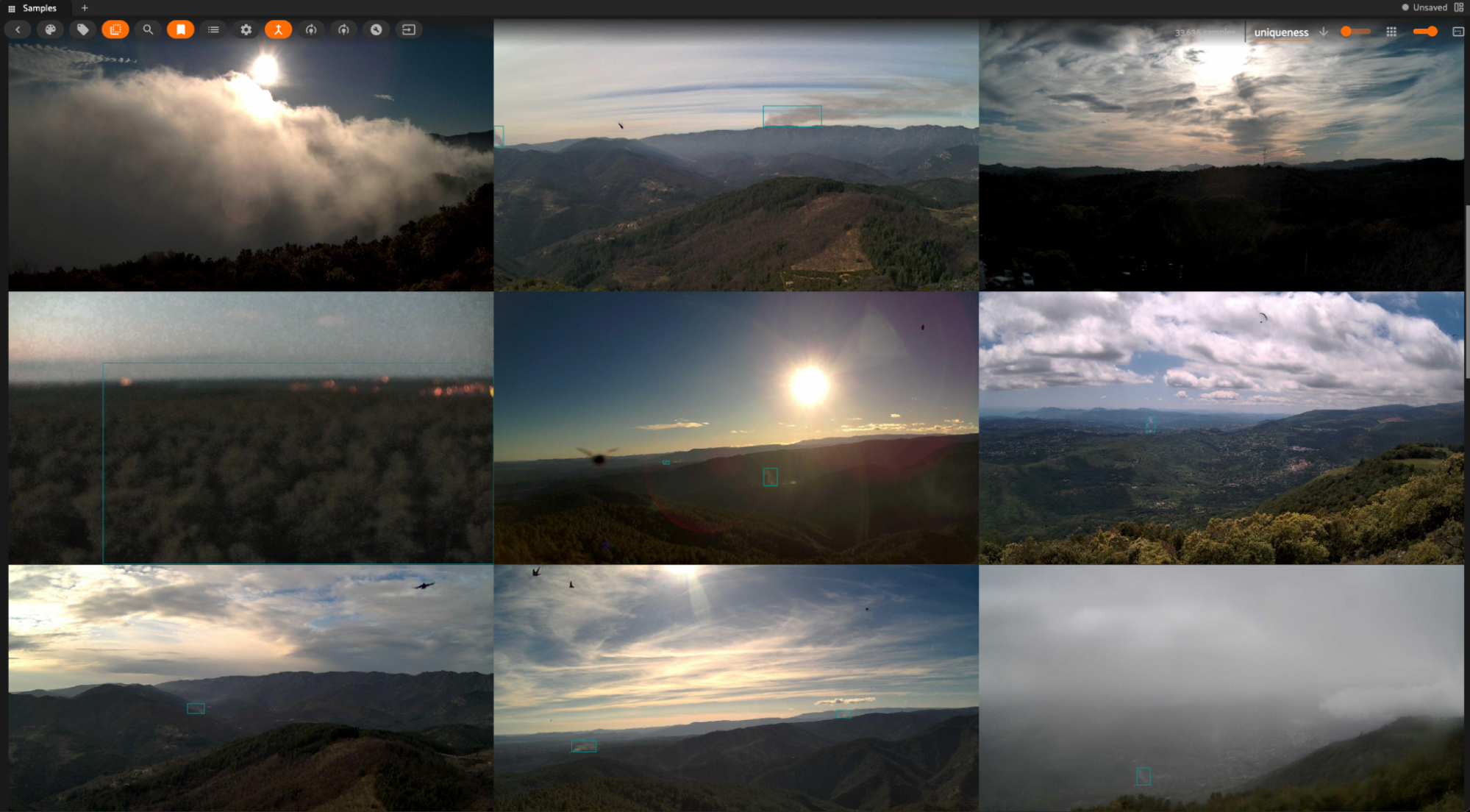 FiftyOne App grid view of nine Pyro-SDIS wildfire camera frames with ground truth smoke bounding box annotations, illustrating the challenge of labeling faint, semi-transparent smoke at long range.