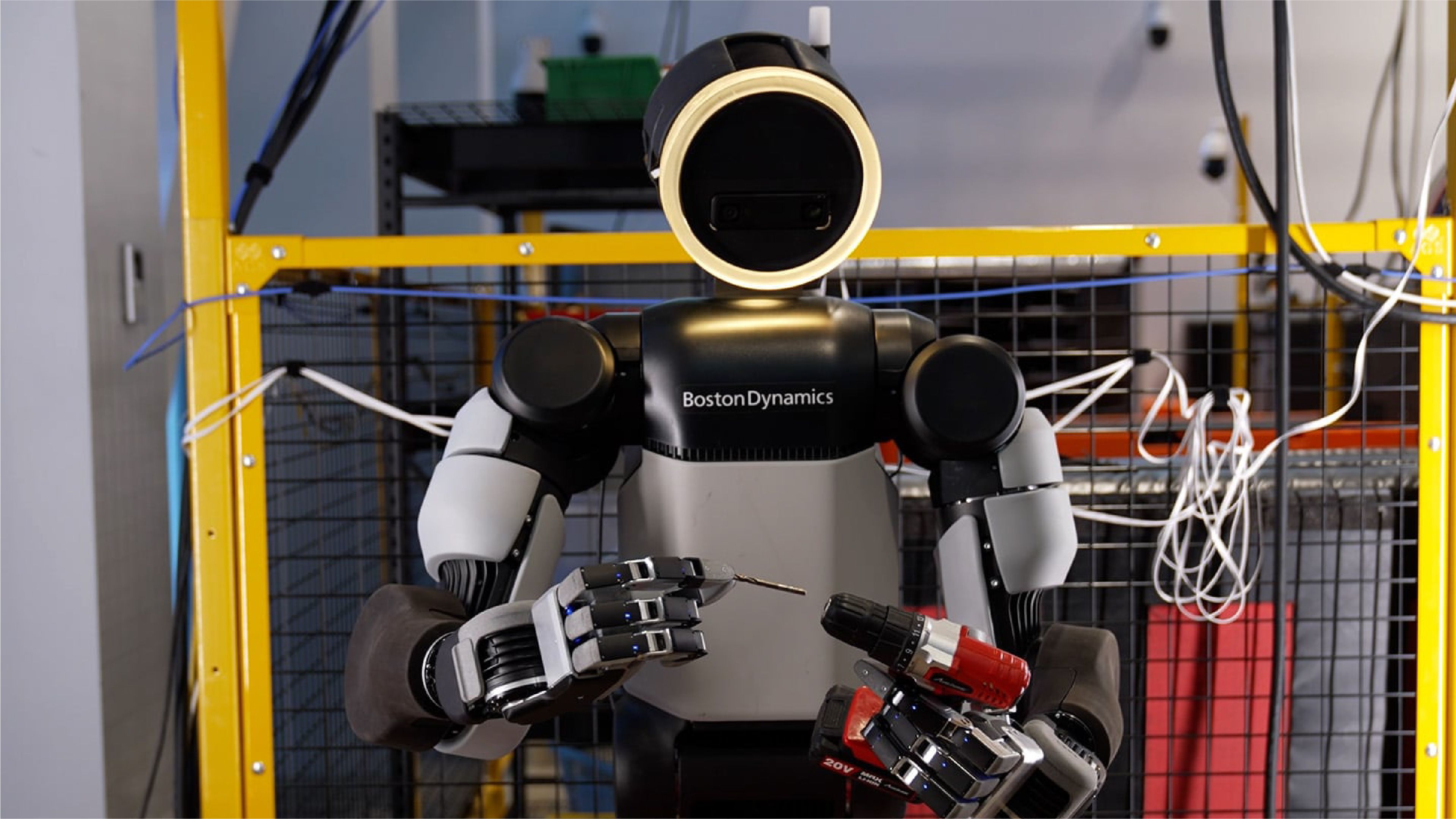 Boston Dynamics’ Atlas humanoid uses its four-fingered hands to hold a drill and drill bit during a manipulation demonstration.
