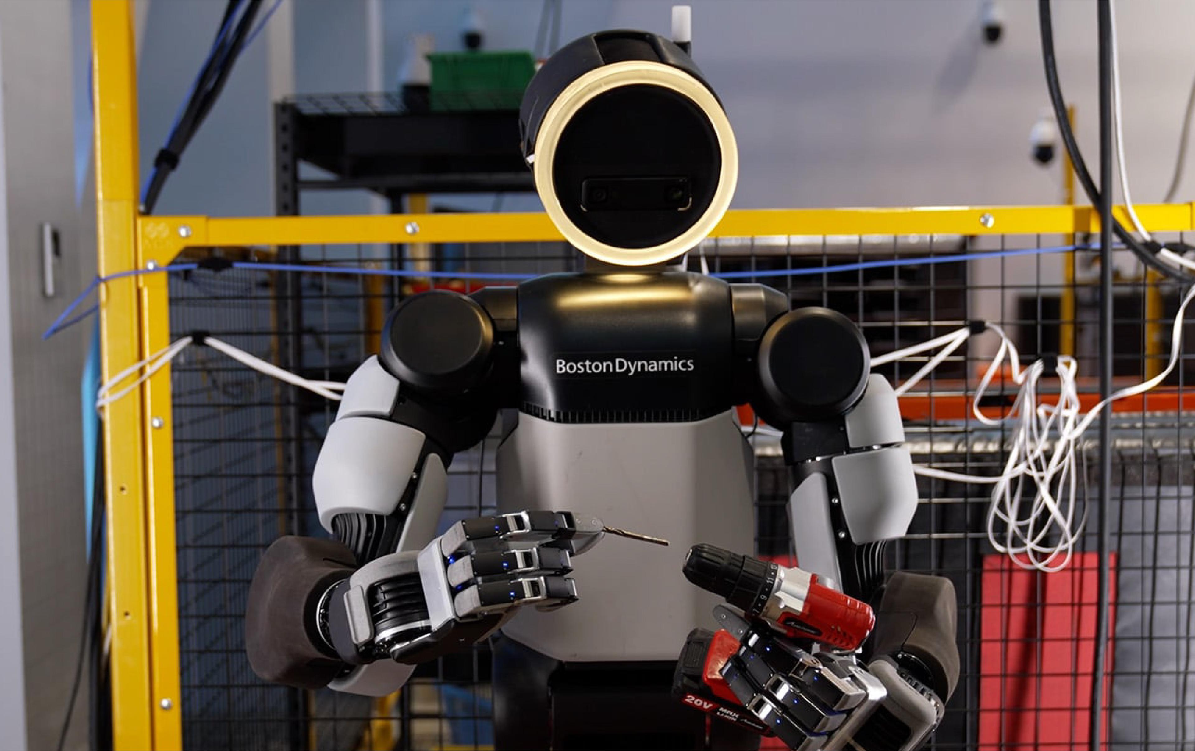 Boston Dynamics’ Atlas humanoid uses its four-fingered hands to hold a drill and drill bit during a manipulation demonstration.