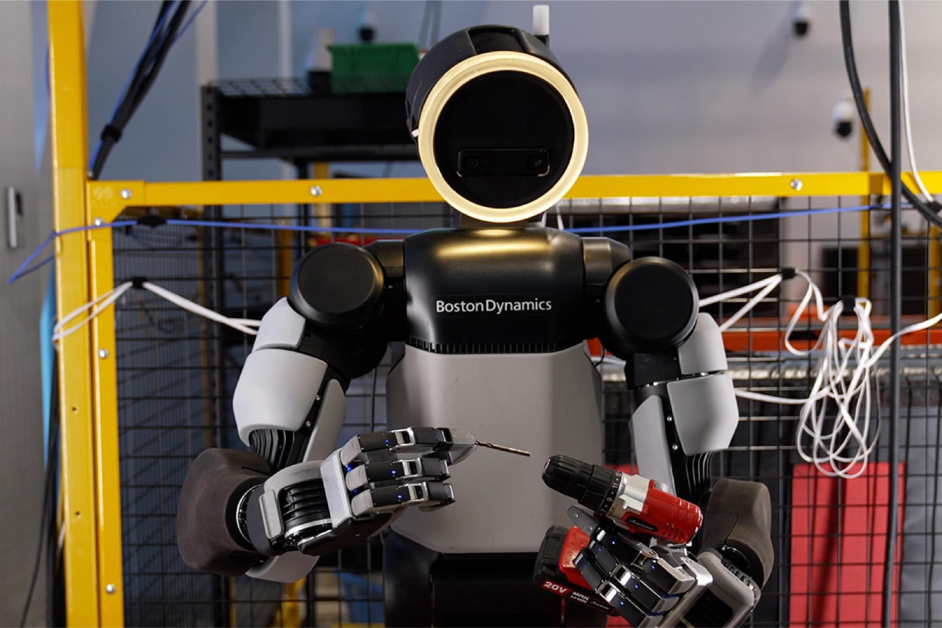 Boston Dynamics’ Atlas humanoid uses its four-fingered hands to hold a drill and drill bit during a manipulation demonstration.