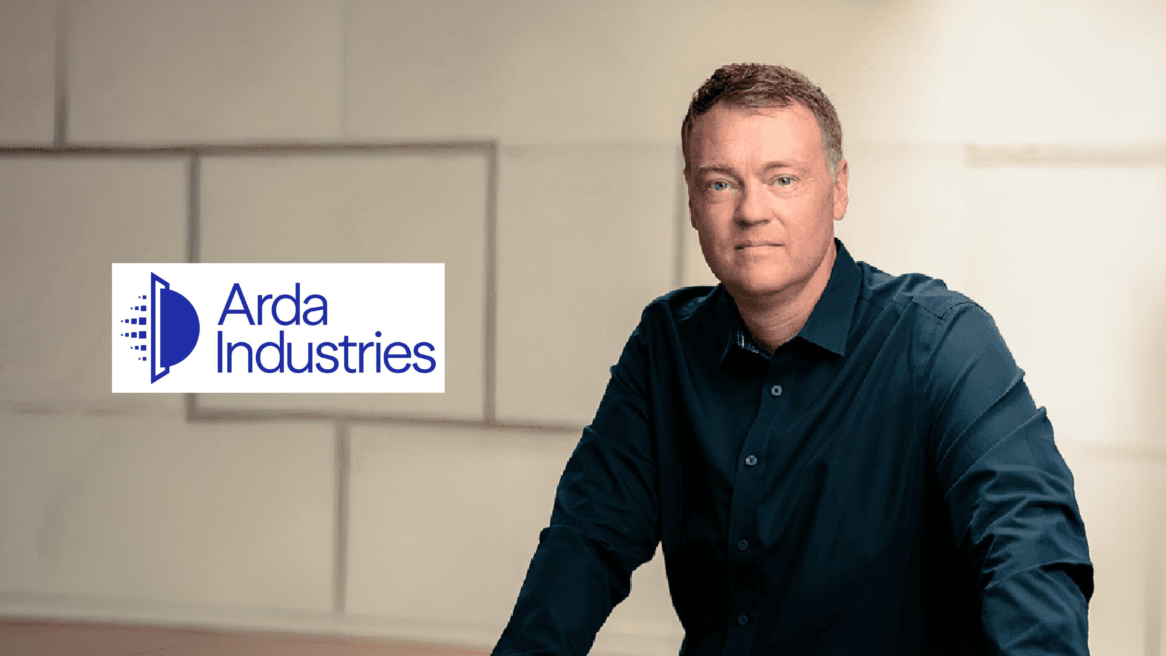 Arda Industries co-founder and CEO Bob McGrew poses next to the company's logo.