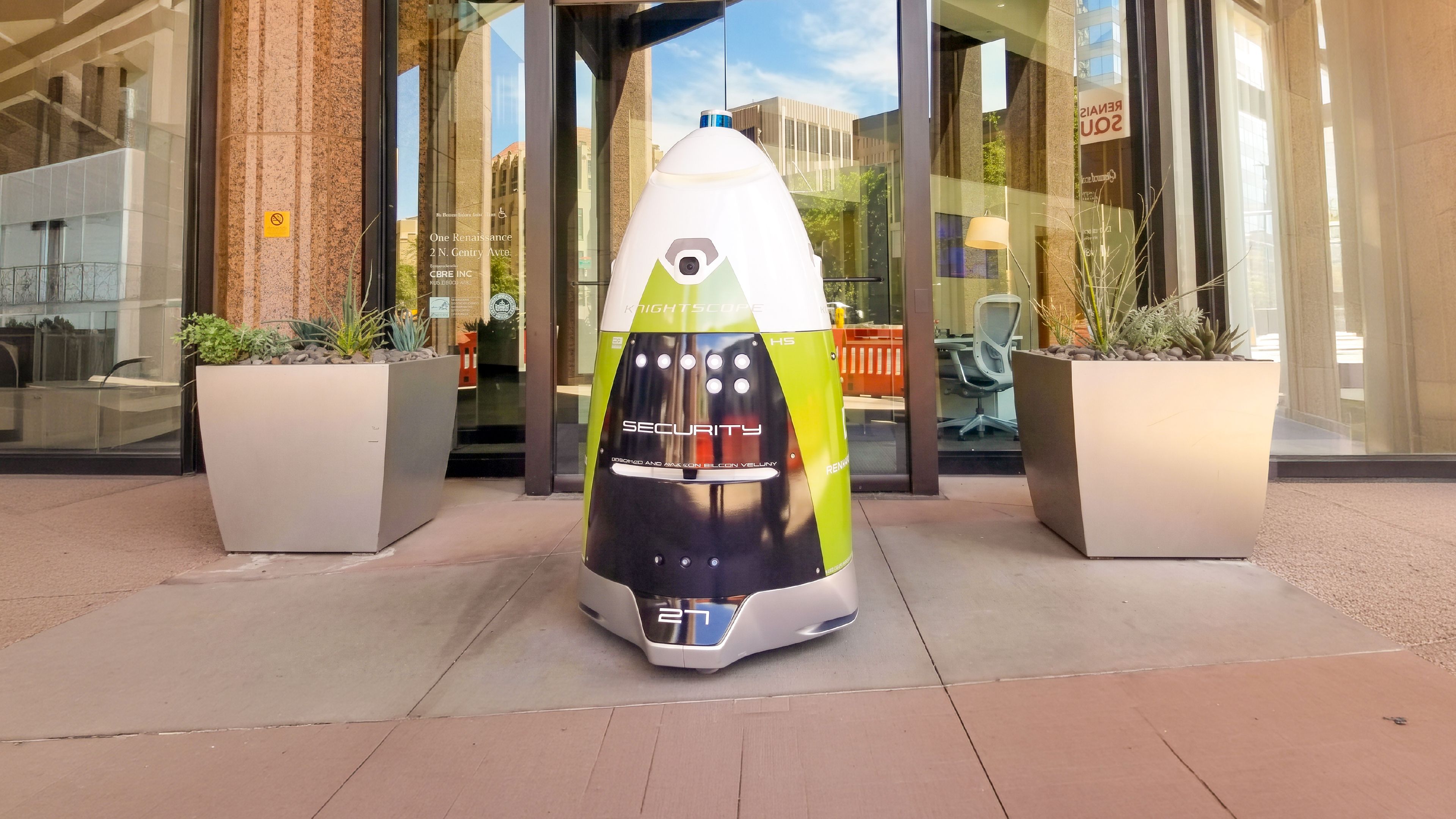 A Knightscope security robot on patrol outside an office building entrance