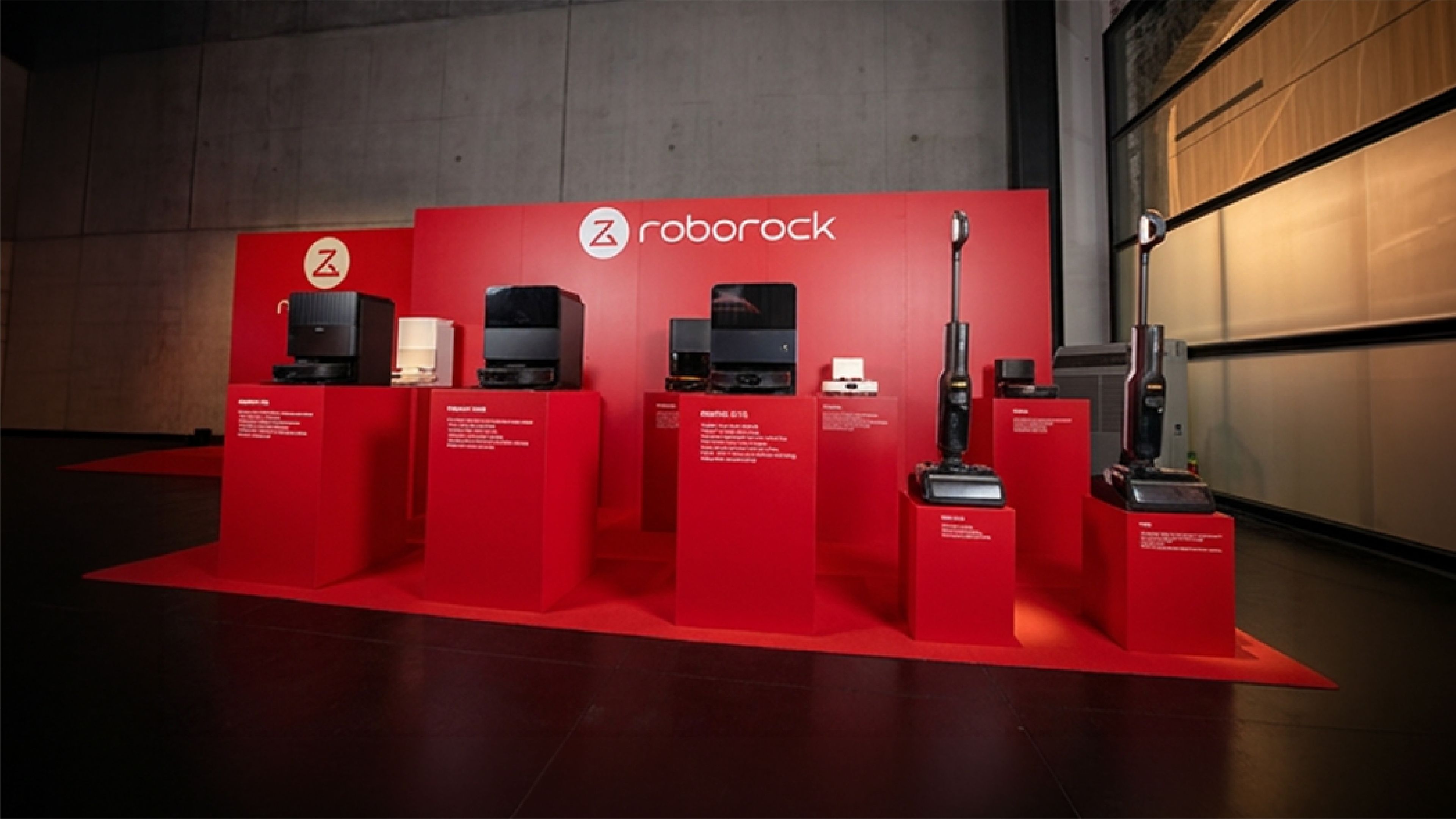 Roborock logo alongside robotic vacuum cleaners