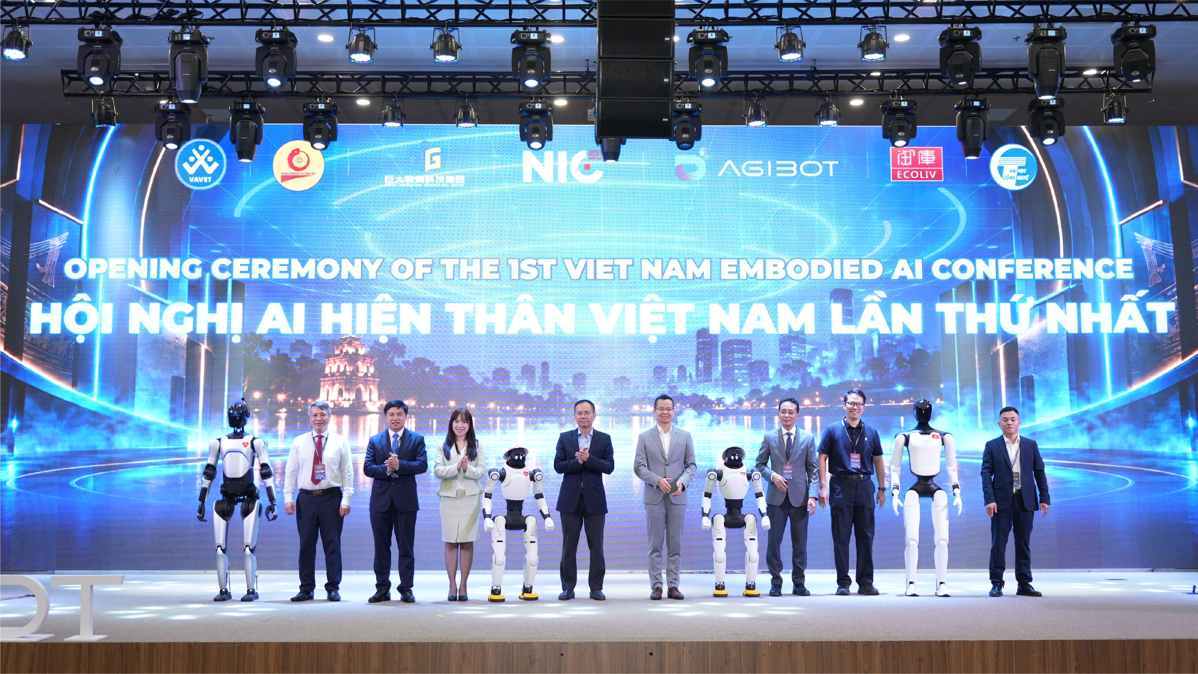 AGIBOT humanoid robots join officials and organizers onstage at the opening ceremony of the first Vietnam Embodied AI Conference in Hanoi.