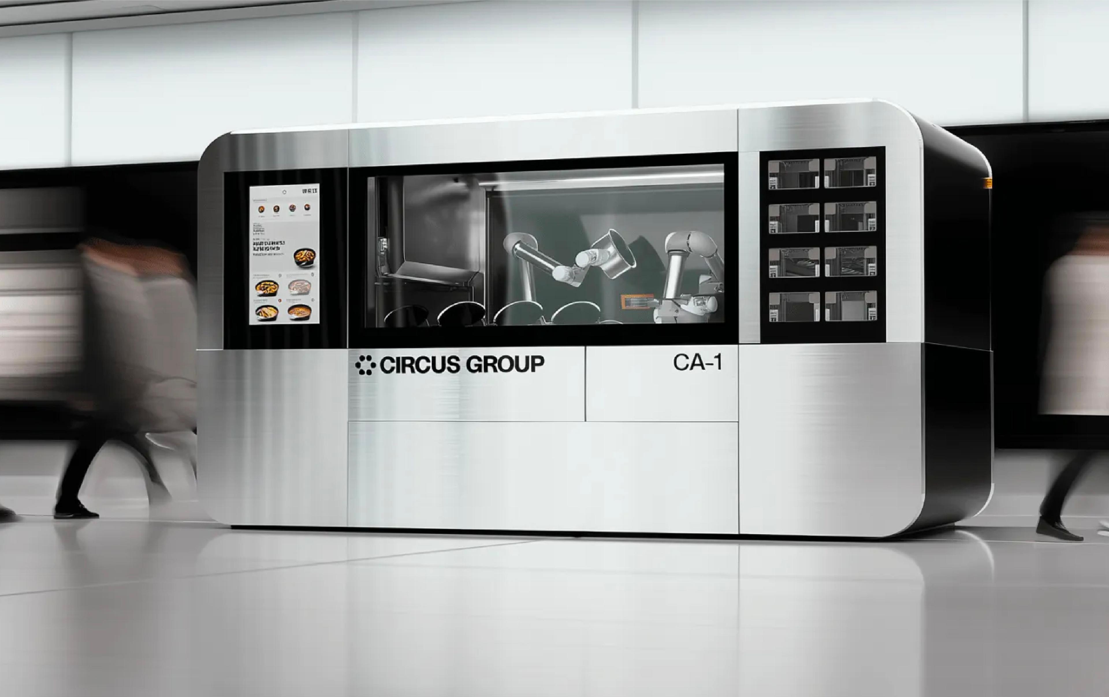 Circus Group’s CA-1 autonomous food-production robot, with robotic arms visible inside the enclosed cooking system.
