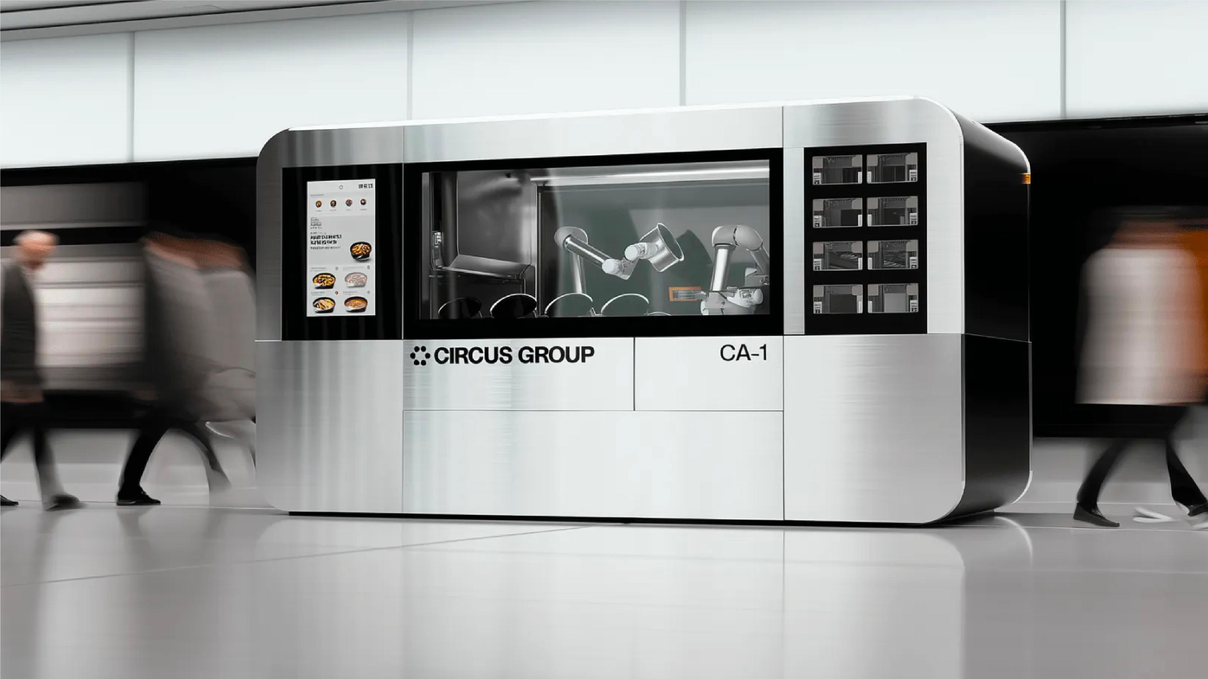 Circus Group’s CA-1 autonomous food-production robot, with robotic arms visible inside the enclosed cooking system.
