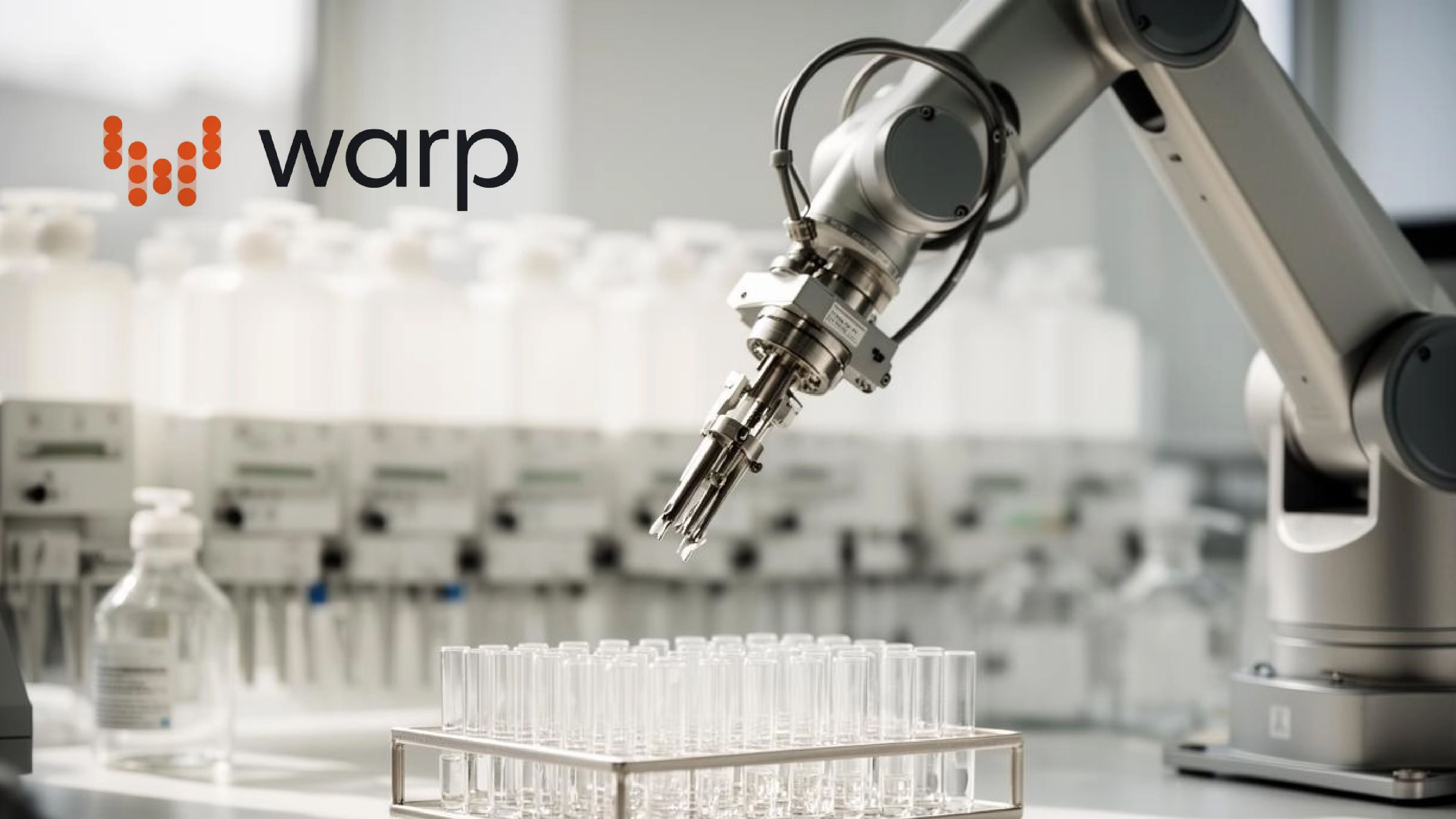 A robotic arm positioned above rows of laboratory test tubes, with the Warp Sciences logo in the upper left corner.