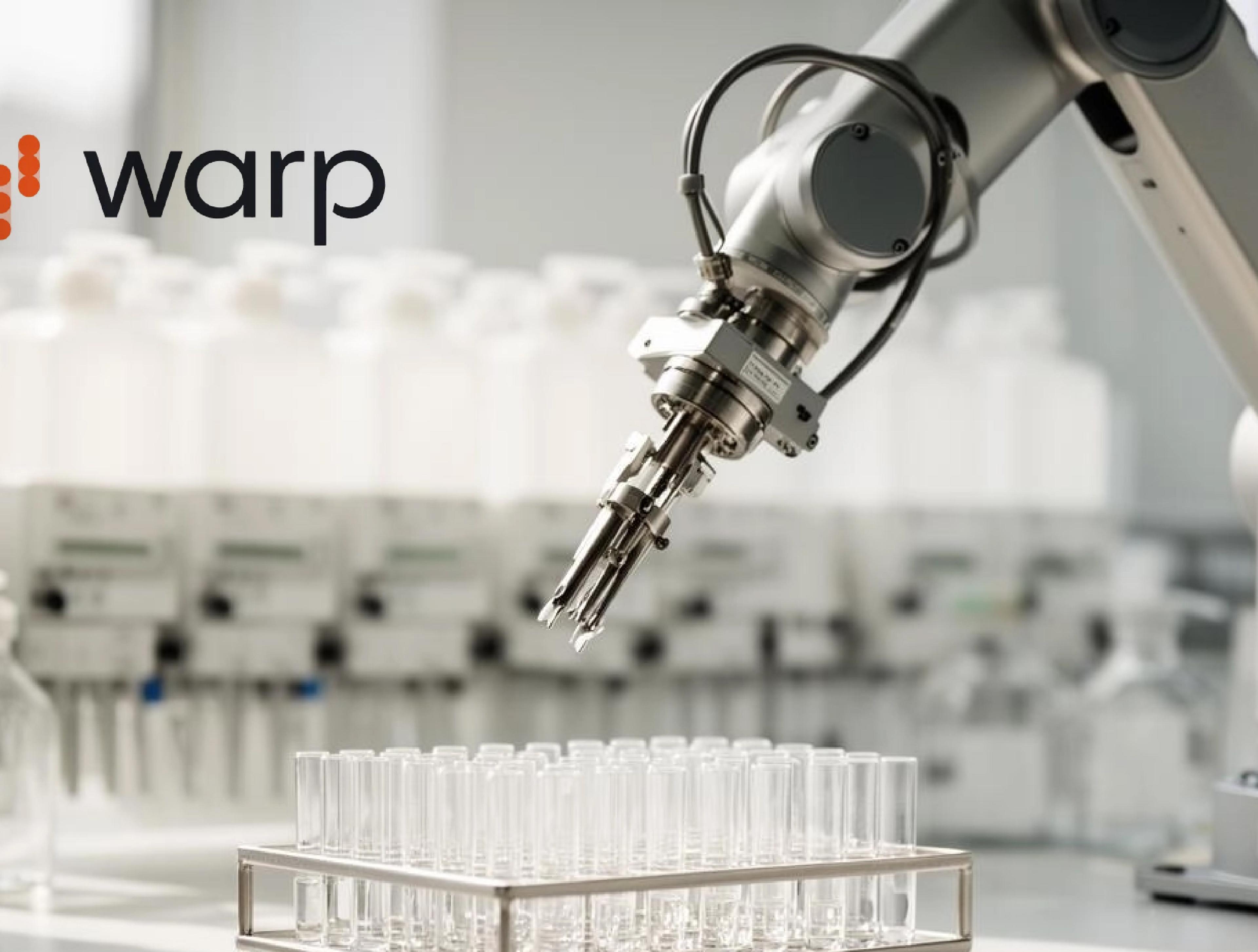 A robotic arm positioned above rows of laboratory test tubes, with the Warp Sciences logo in the upper left corner.