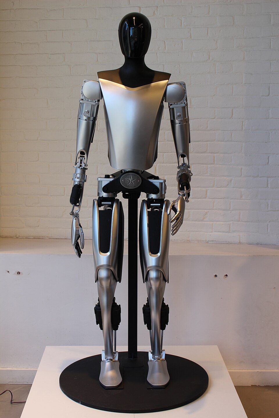 Humanoid robot standing in a workshop