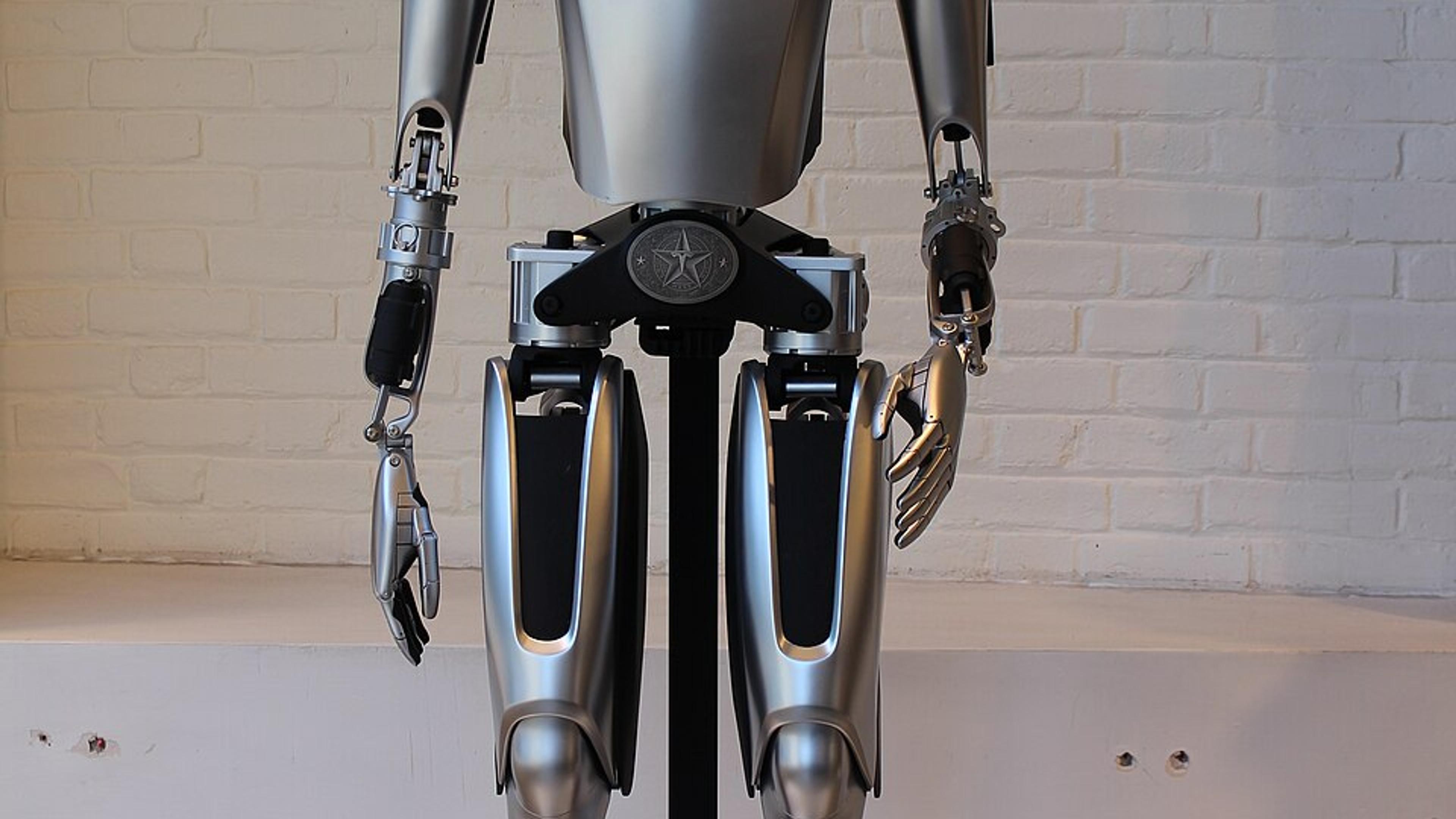 Humanoid robot standing in a workshop