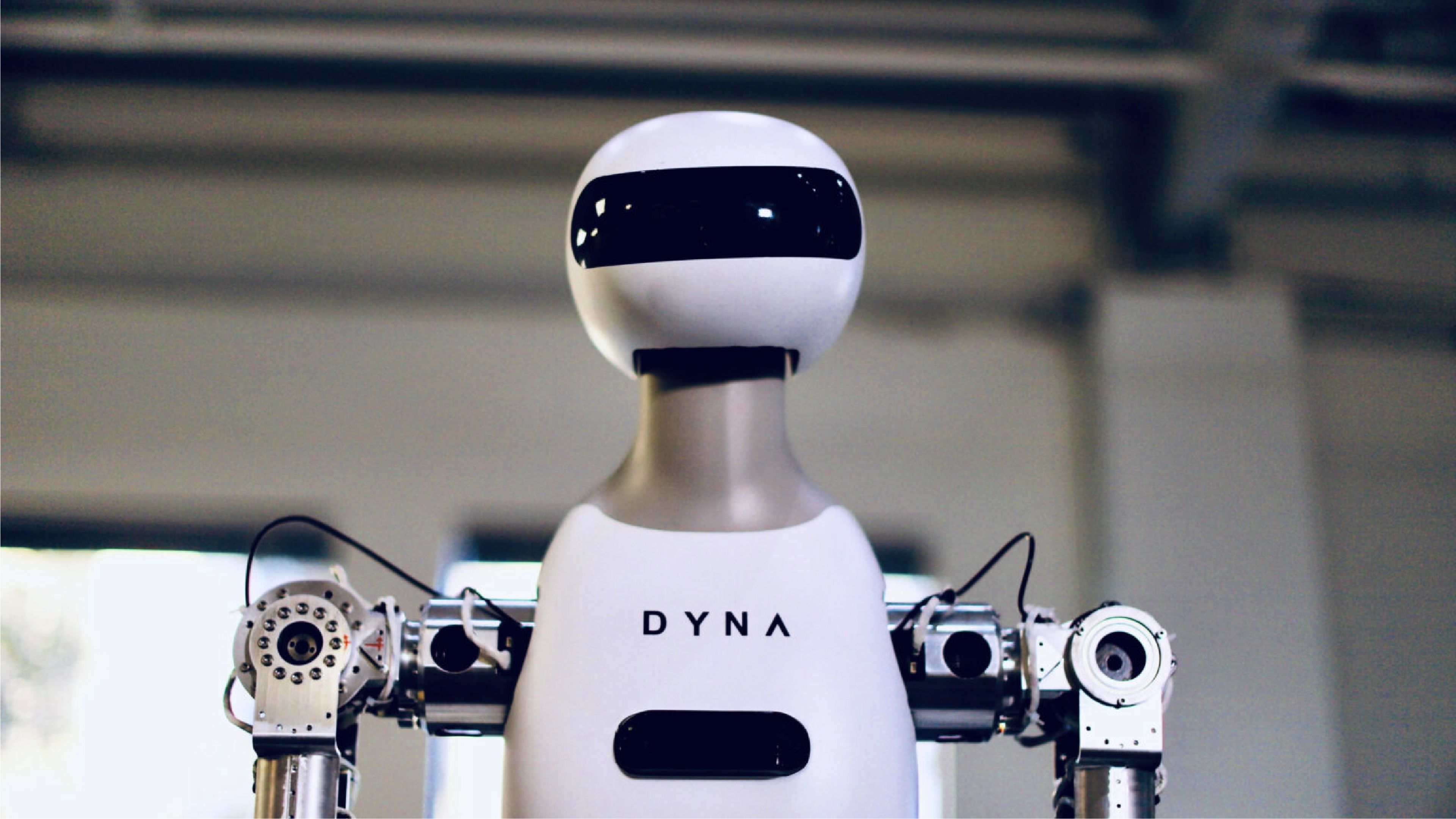 Dyna Robotics’ Taku semi-humanoid robot, featuring two articulated arms and a wheeled mobile base.