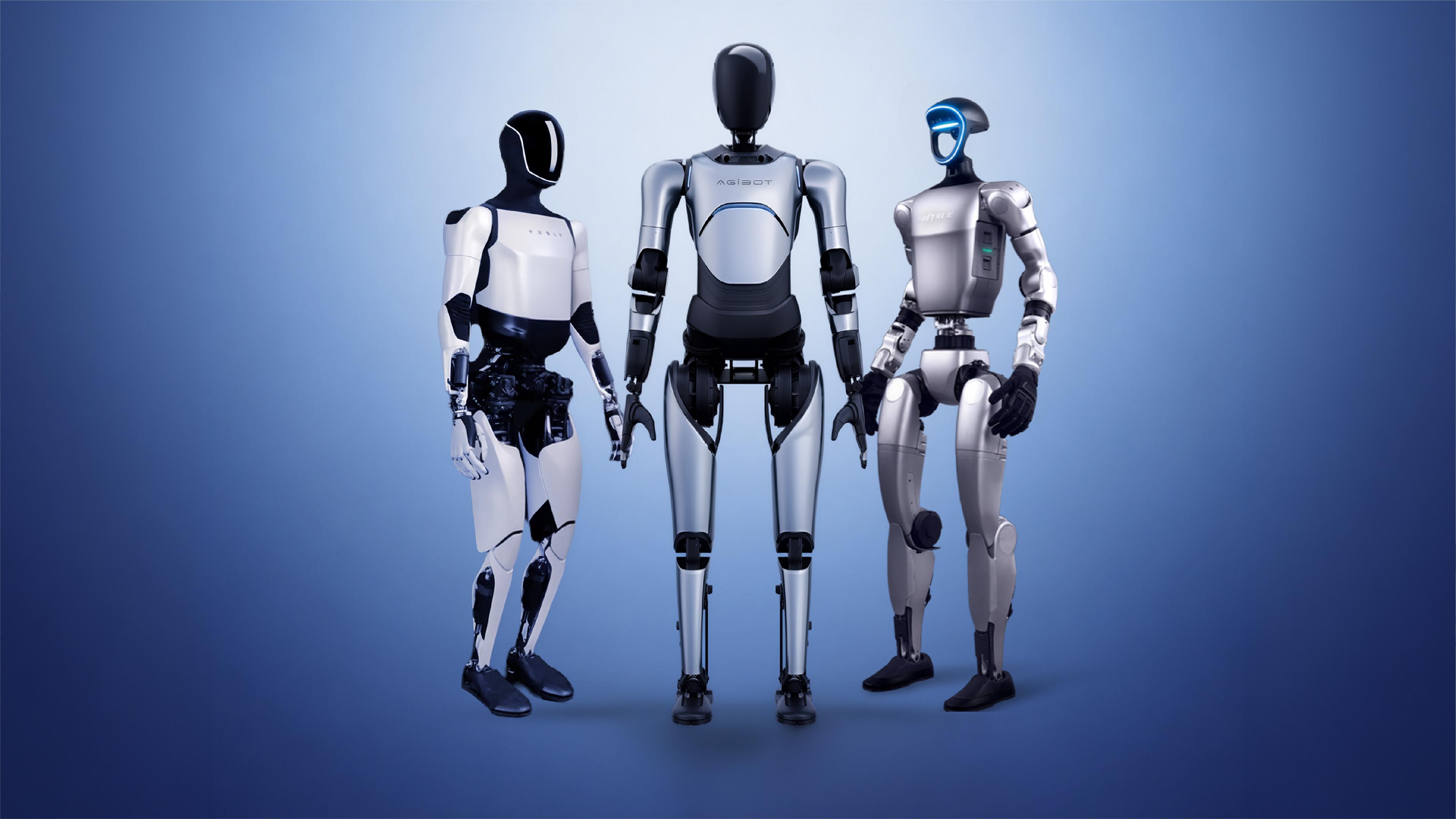 Three humanoid robots of different designs standing side by side on a blue studio background