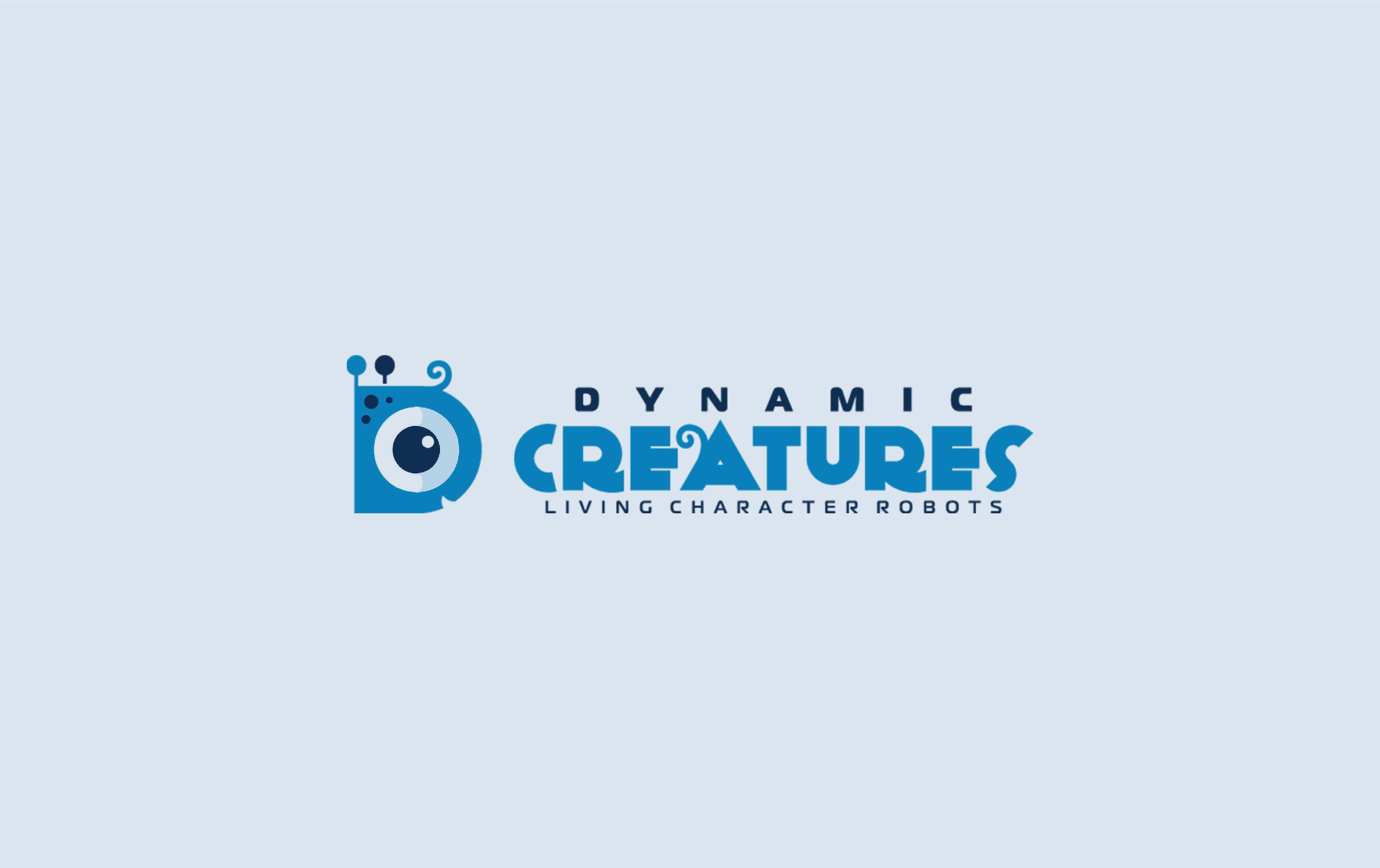 Logo for Dynamic Creatures, "Living Character Robots," featuring a stylized letter D shaped like a blue robotic creature with a single large eye, antennae and a curled tail, next to the company name in blue and navy lettering.
