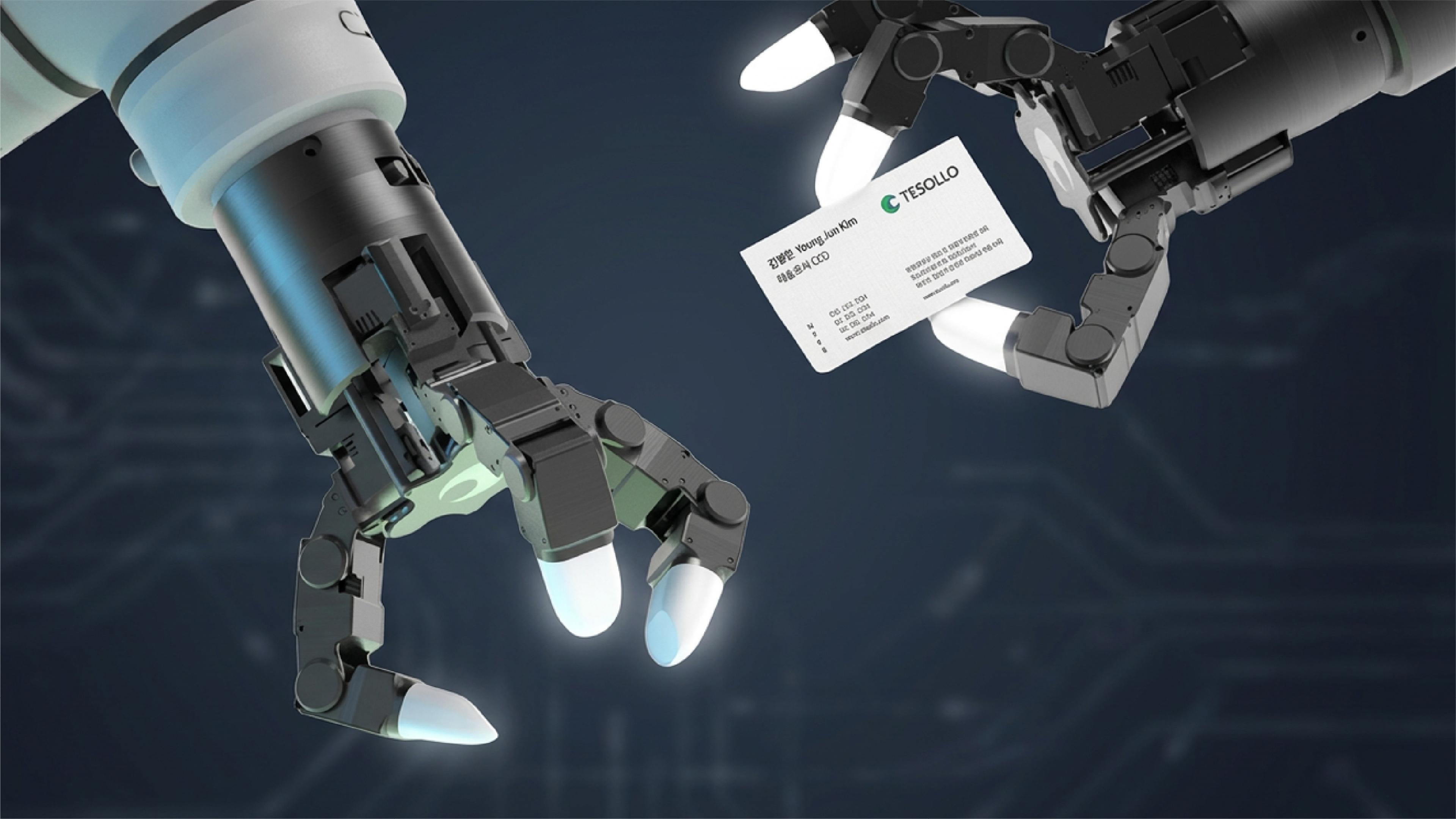 Two Tesollo robotic hands, one holding a Tesollo business card.