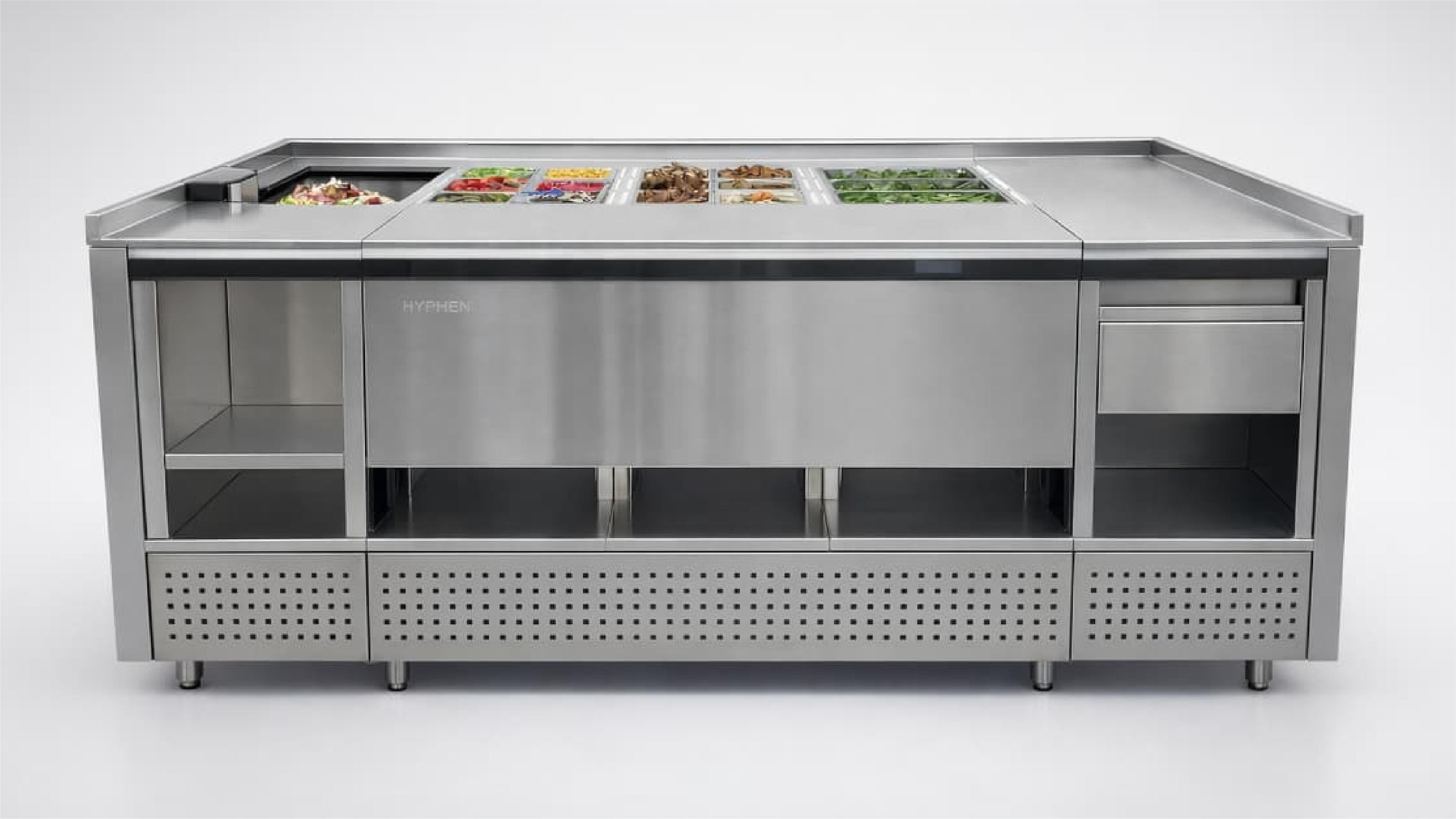 Hyphen's robotic food-preparation system above an enclosed under-counter automation unit.