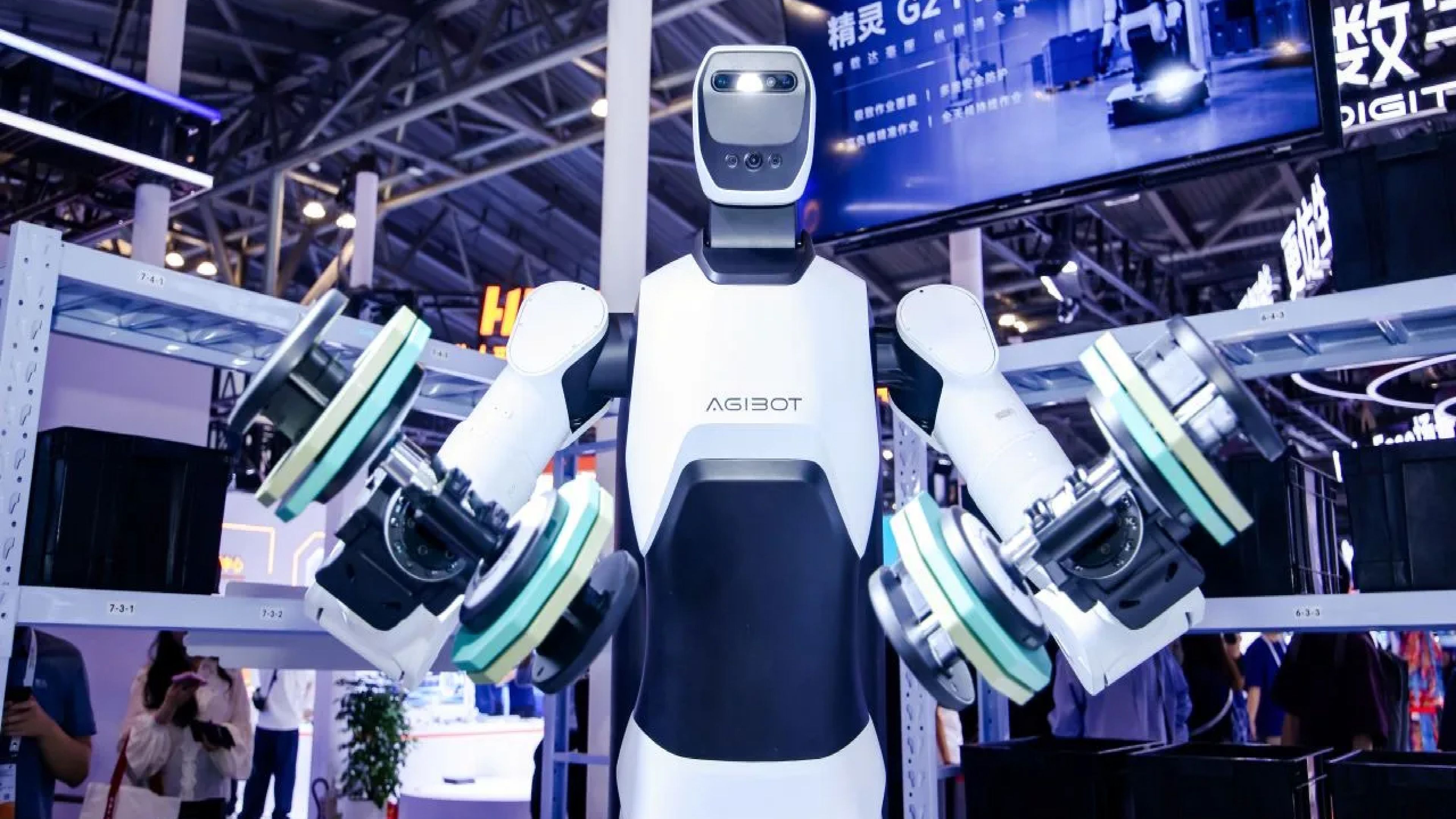 AGIBOT humanoid robot demonstrates a weightlifting motion with two dumbbells at a technology exhibition.