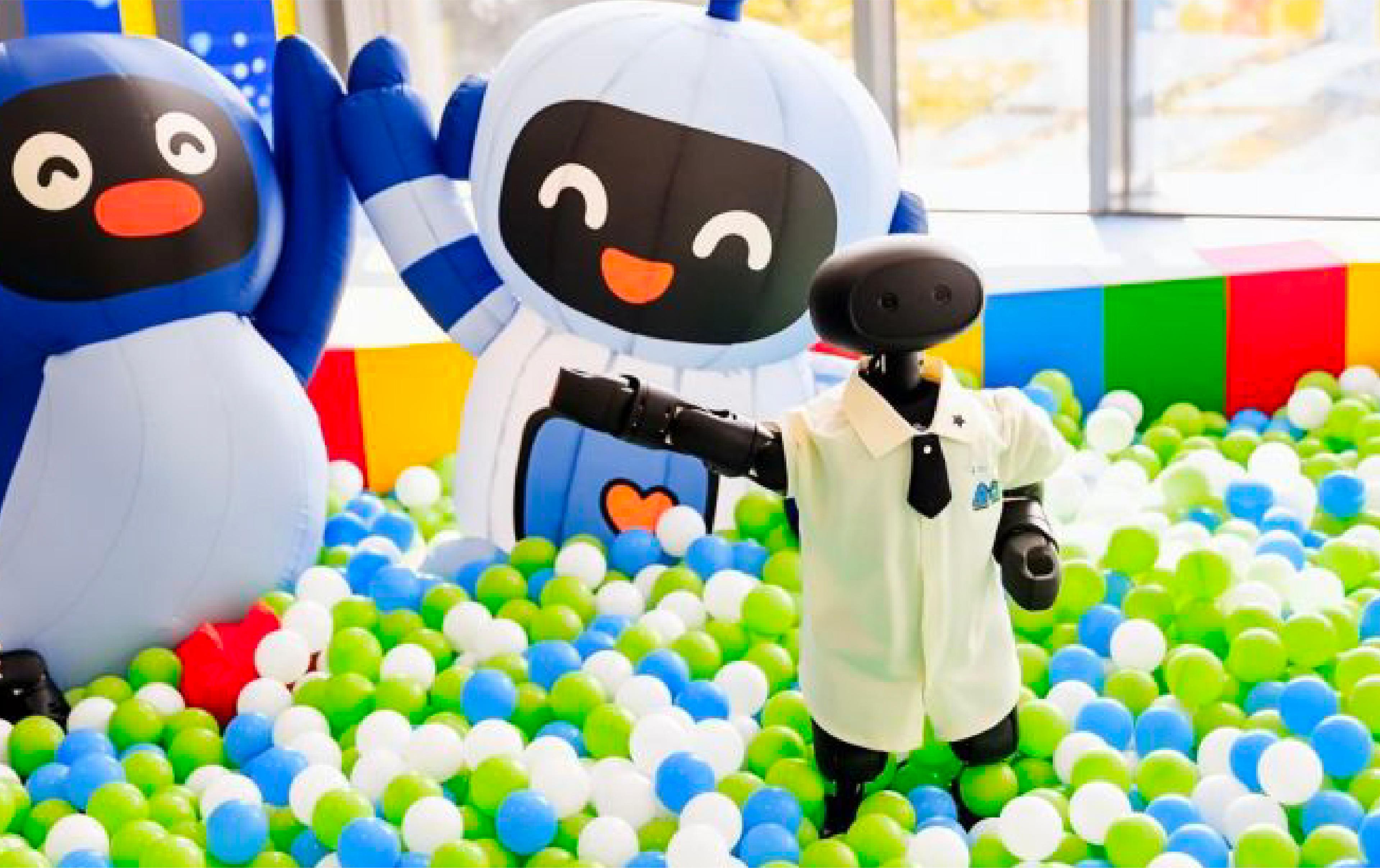 A vibrant room filled with colorful balloons and various stuffed animals scattered throughout the space.