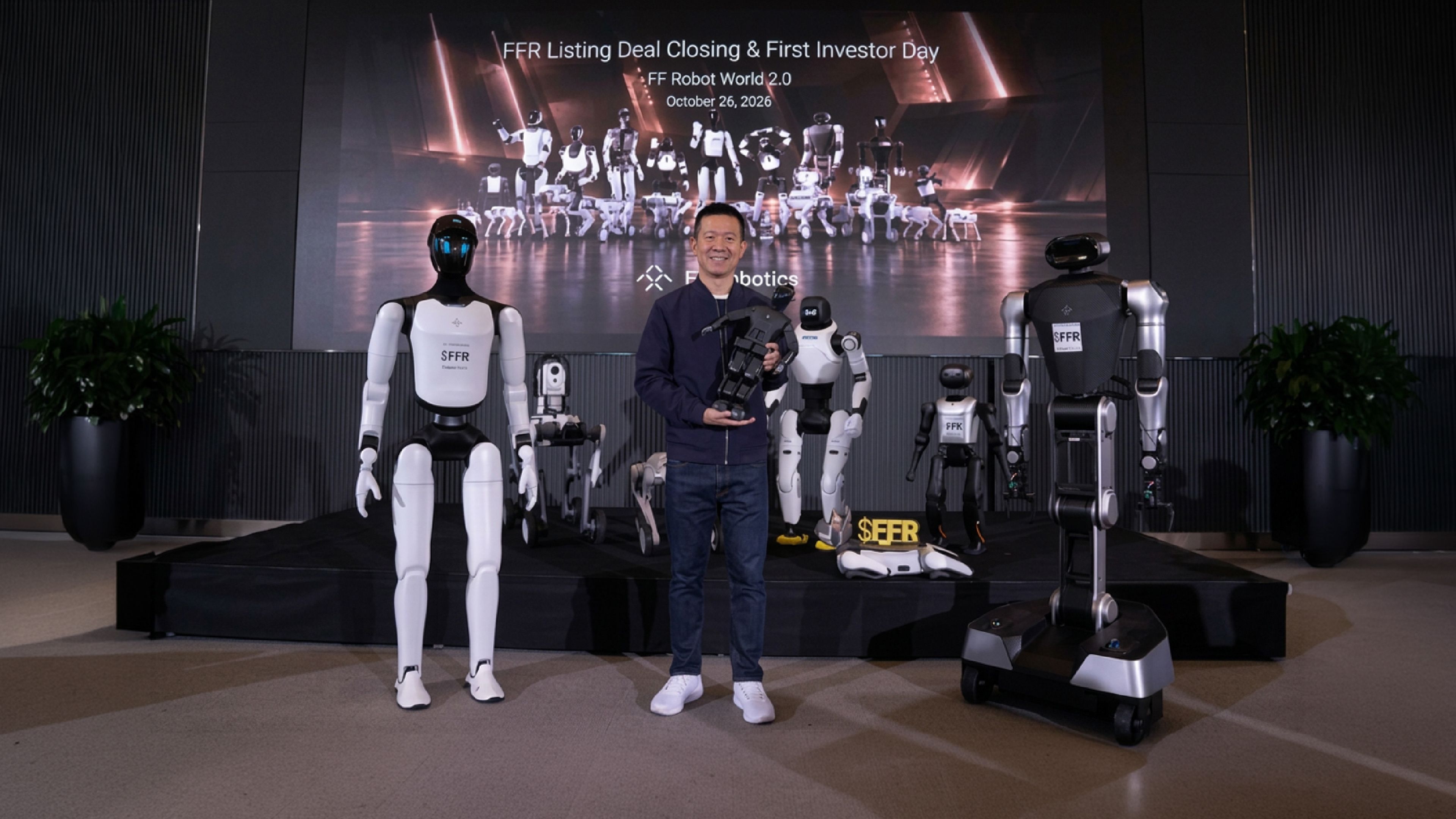 YT Jia, CEO of Faraday Future and FFR, poses with several humanoid and wheeled robots at FFR's listing deal closing and investor day event on Oct. 26, 2026.