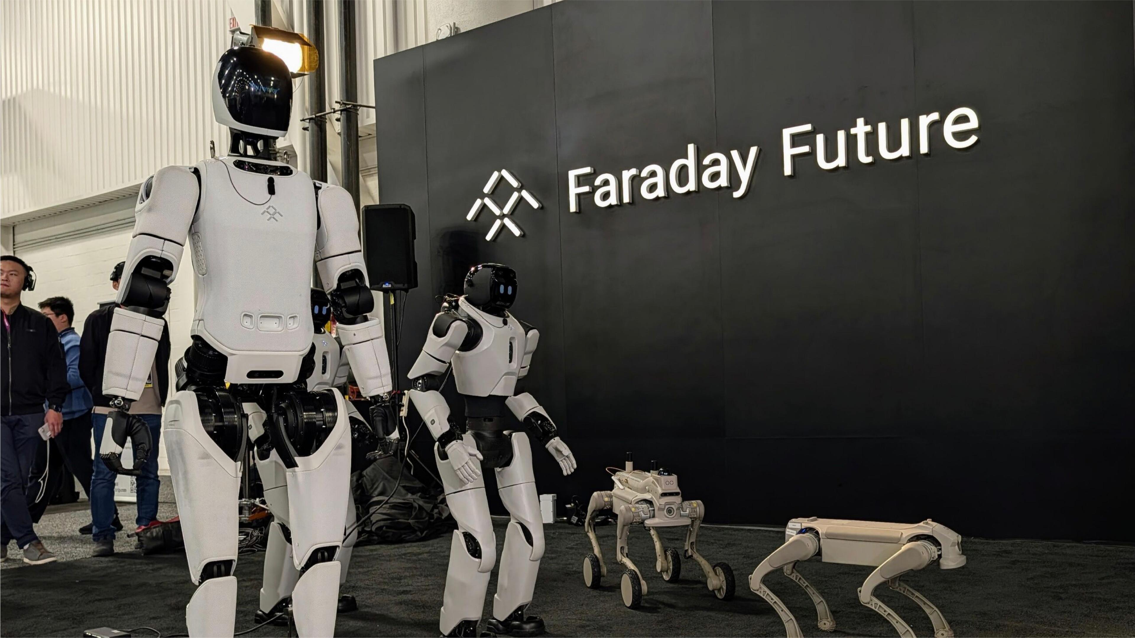 Faraday Future humanoid and quadruped robots displayed in front of the company’s logo at an exhibition.