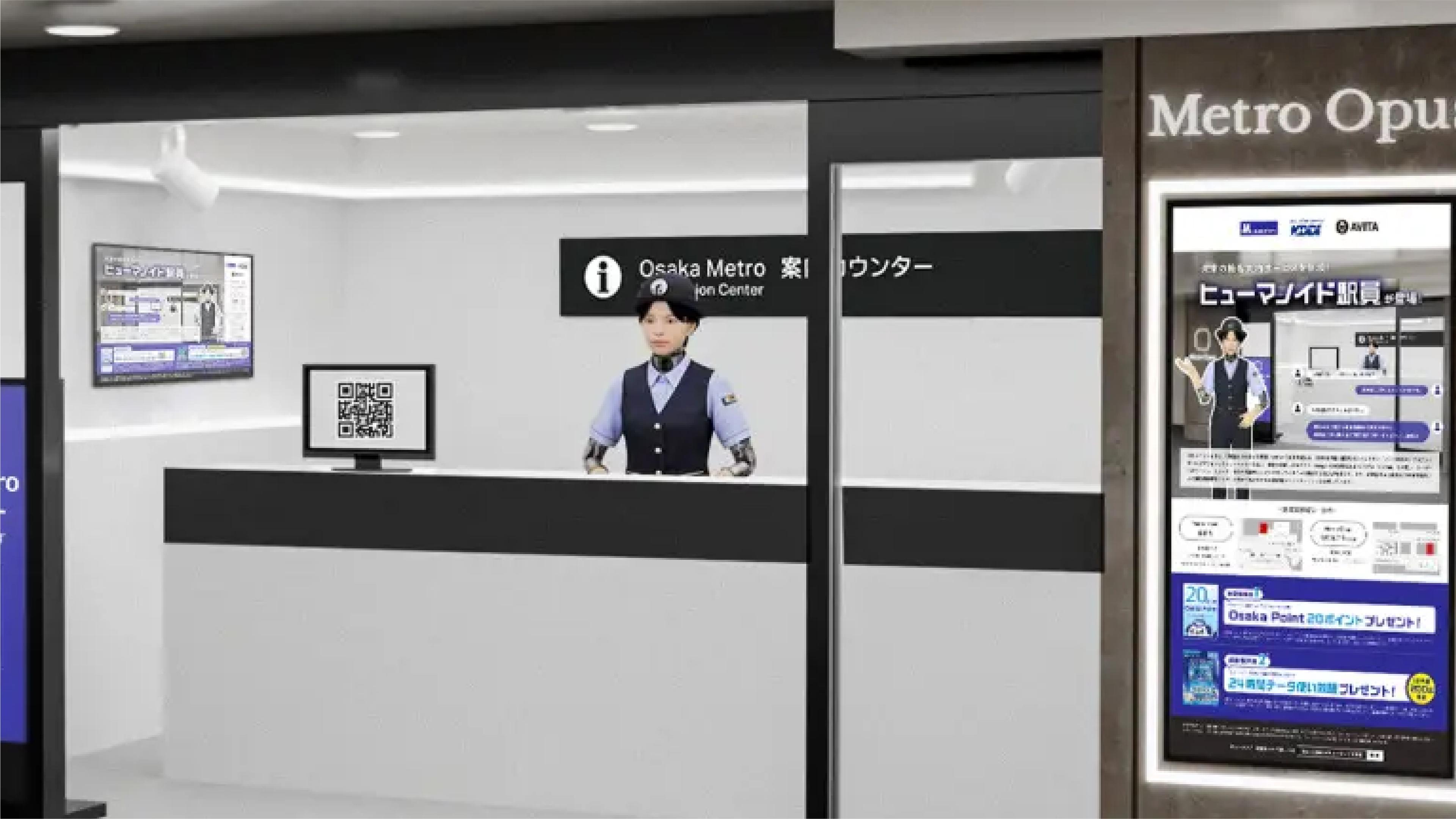 Humanoid robot dressed as an Osaka Metro staff member stands behind an information counter at a Japanese subway station.