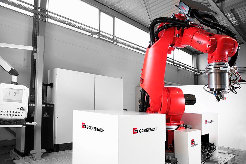 Large KUKA industrial robot in a production hall