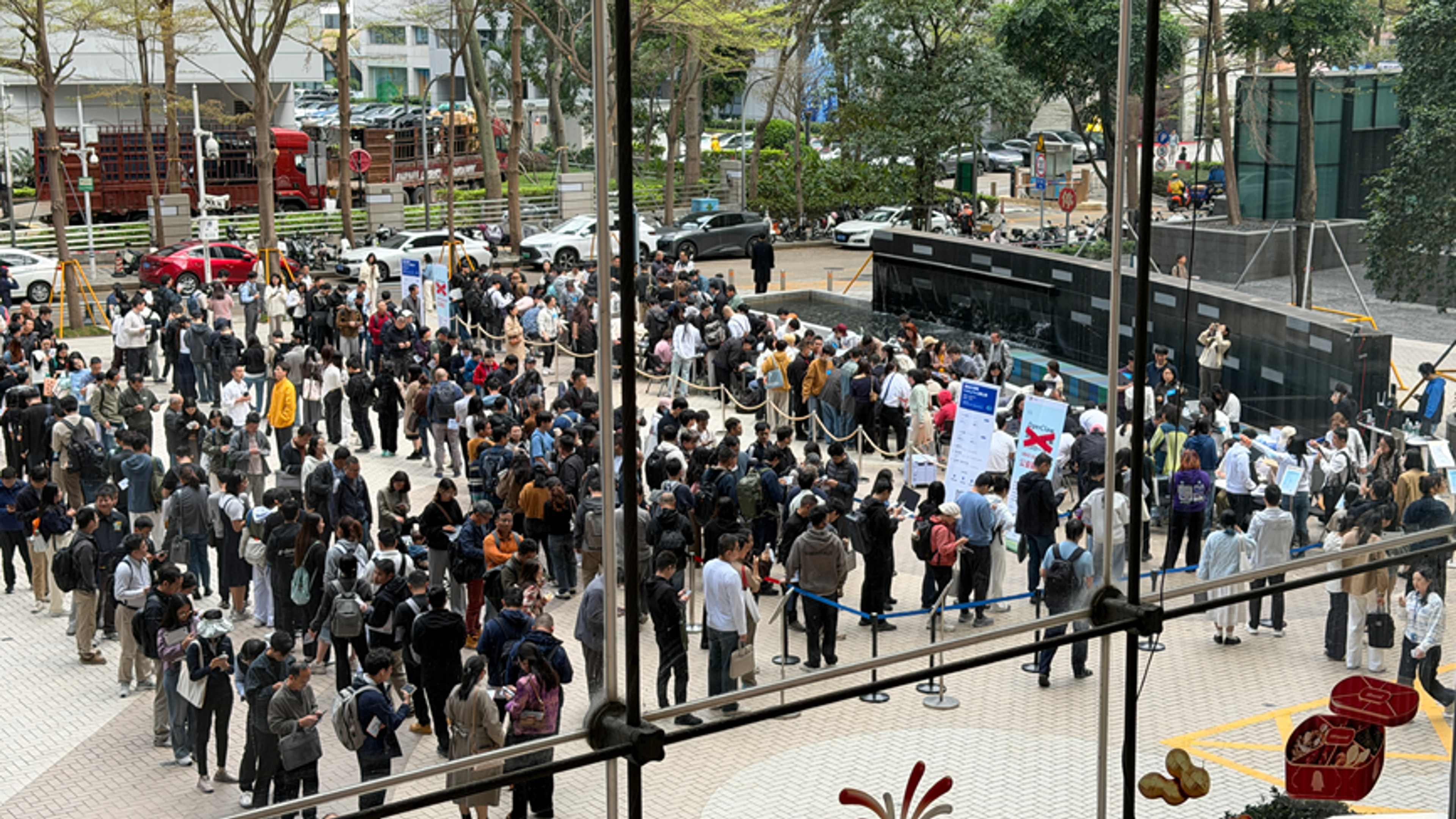 Crowd lining up at Tencent's Shenzhen headquarters to install OpenClaw, March 2026