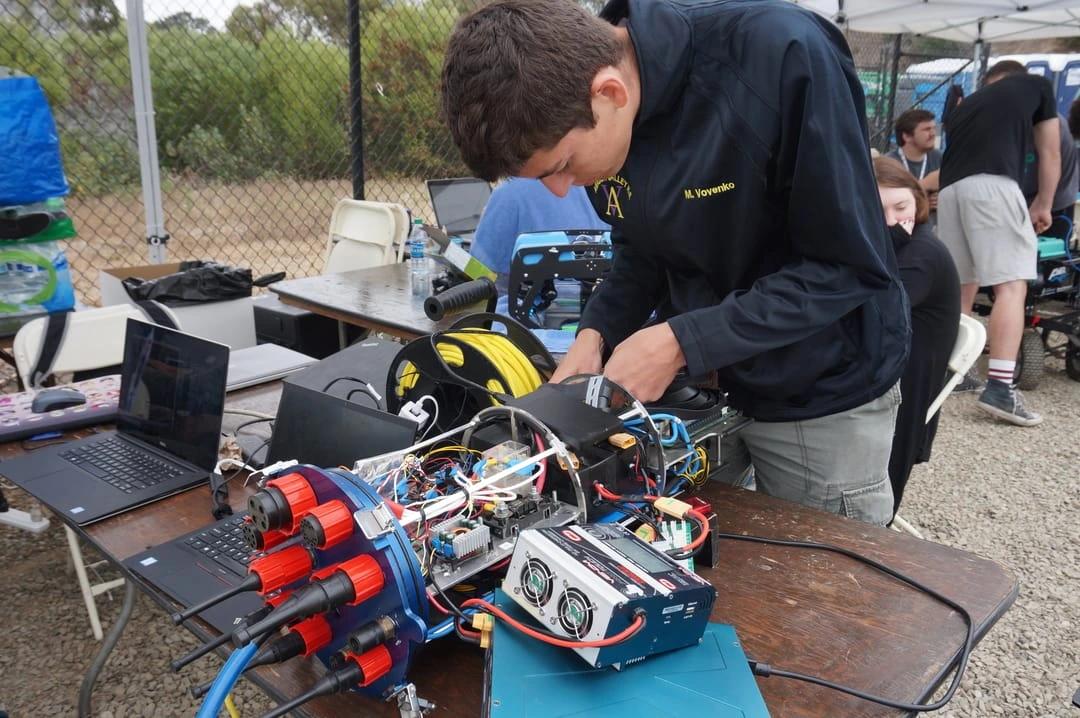 A member of the electrical subteam working on the wiring for our AUV, Marlin